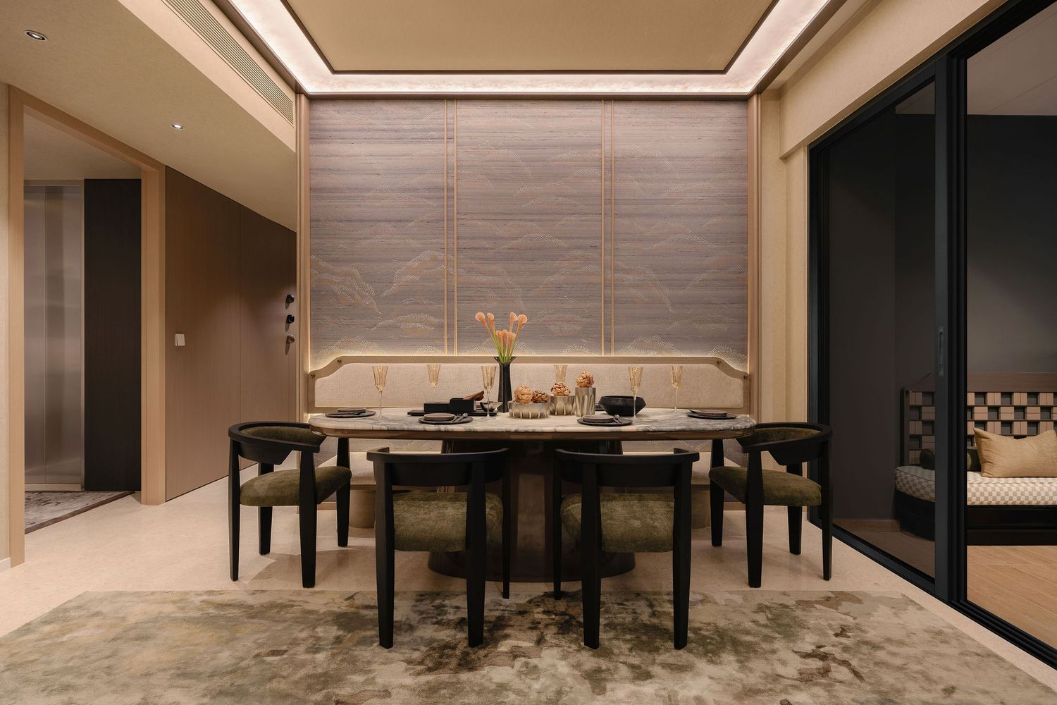 Elegant modern dining room with a round table, four upholstered chairs, wood blinds, a banquette bench and a textured area rug.