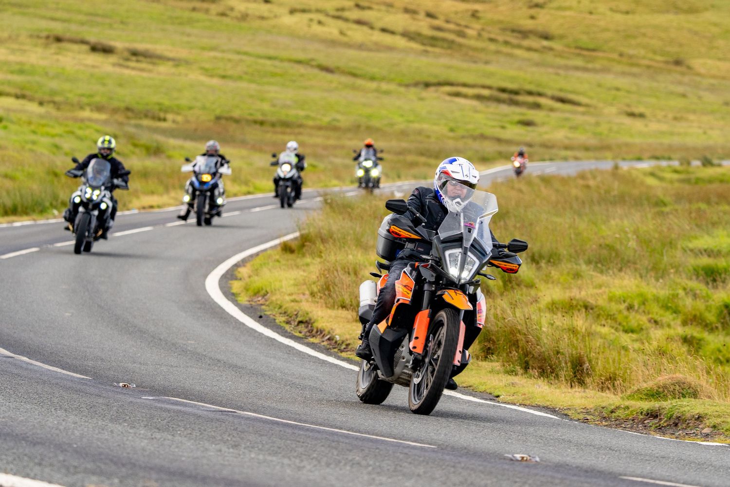 Group of motorcyclists riding in Wales on A4059