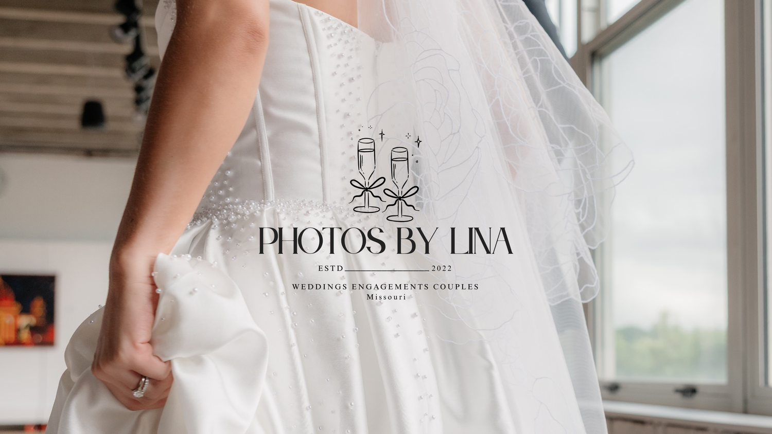 Bride in white wedding gown held by Photos by Lina, wedding and engagement couples photographer logo.