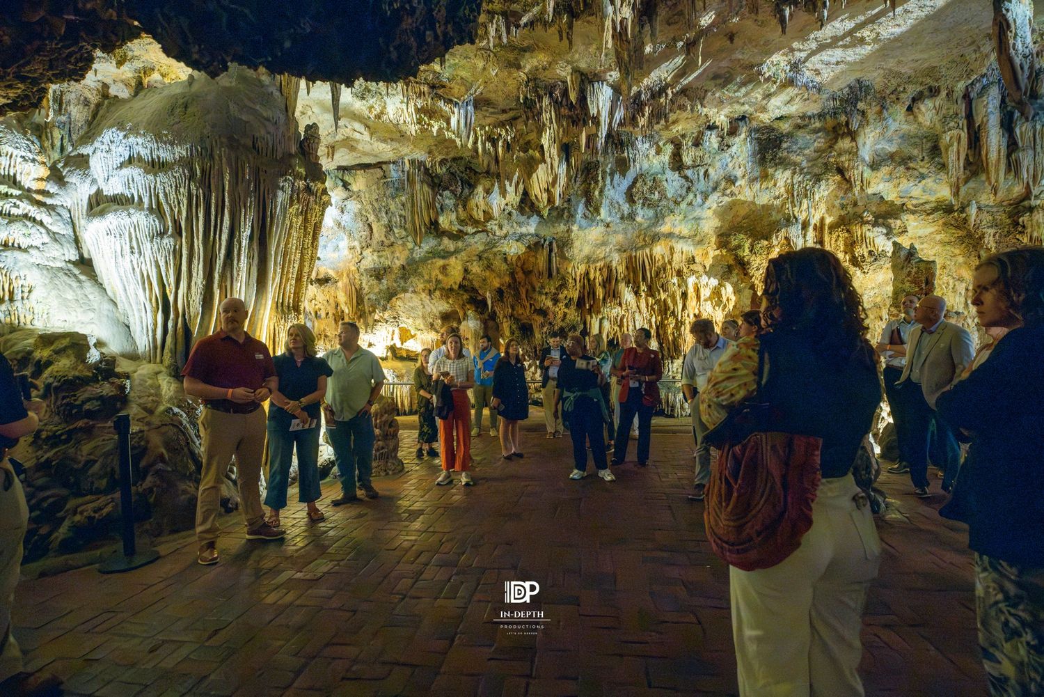 VRLI participants walking through illuminated formations at Luray Caverns.