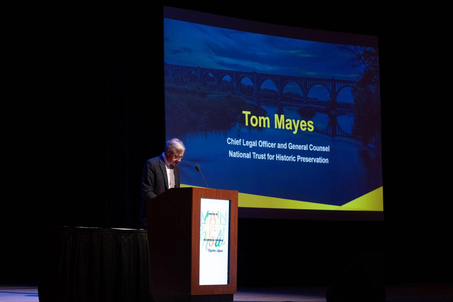 Tom Mayes, Chief Legal Officer of National Trust for Historic Preservation, delivers a keynote speech at a podium.