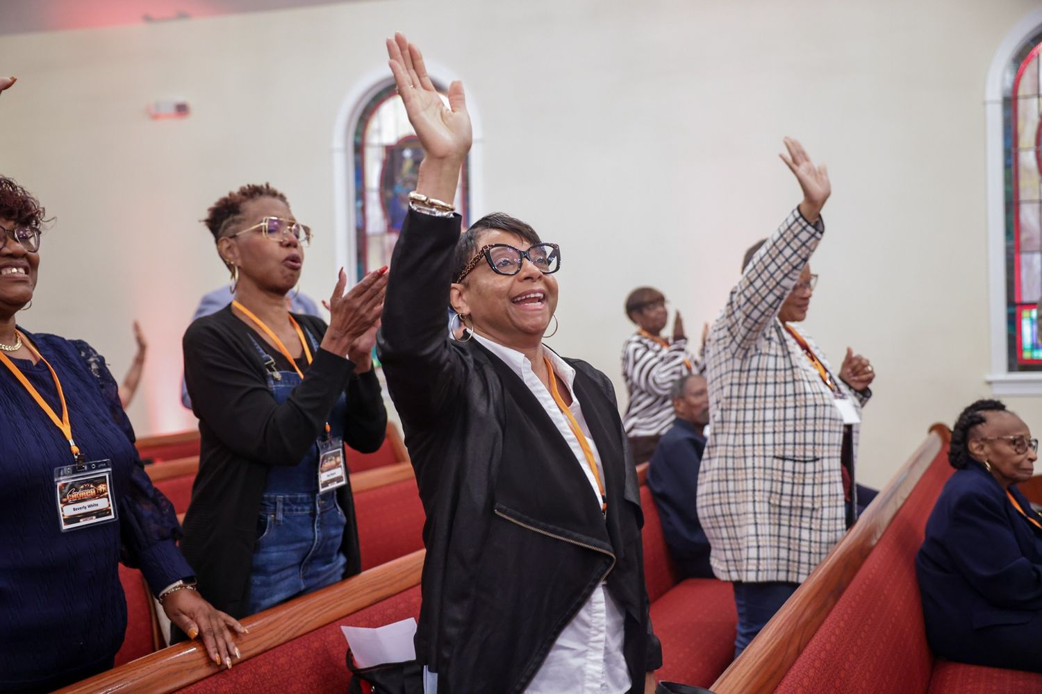 Congregation members stand with hands raised in the sanctuary at Spring Hill Baptist Church’s Kingdom Ready 2027 Leadership Conference.