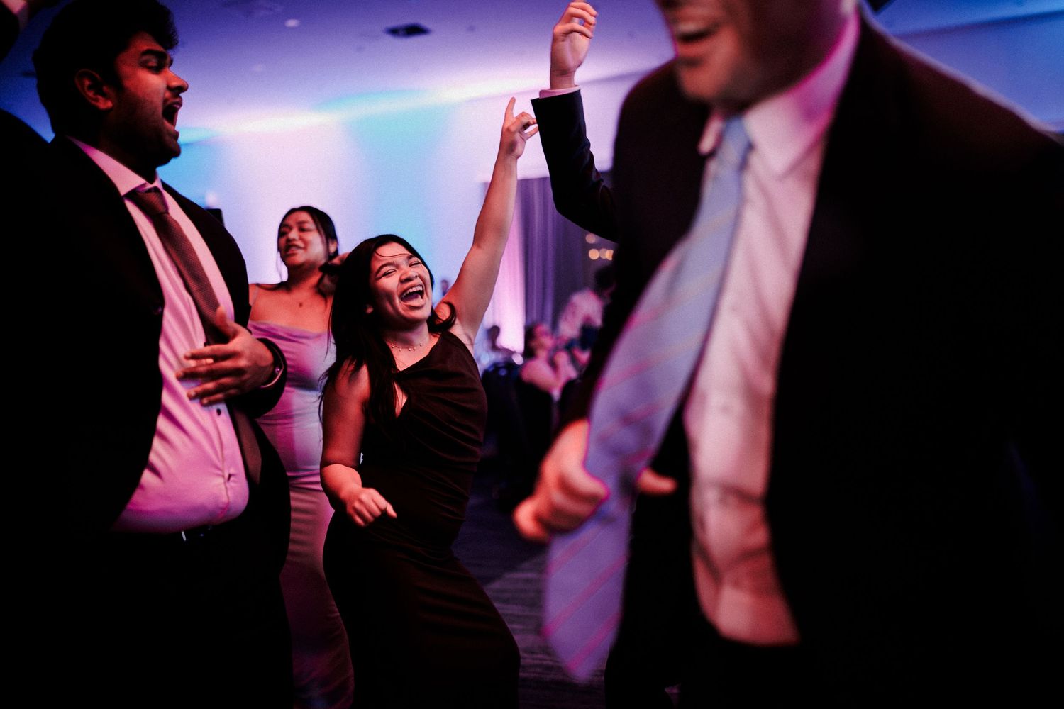 A woman dancing at a corporate celebration.