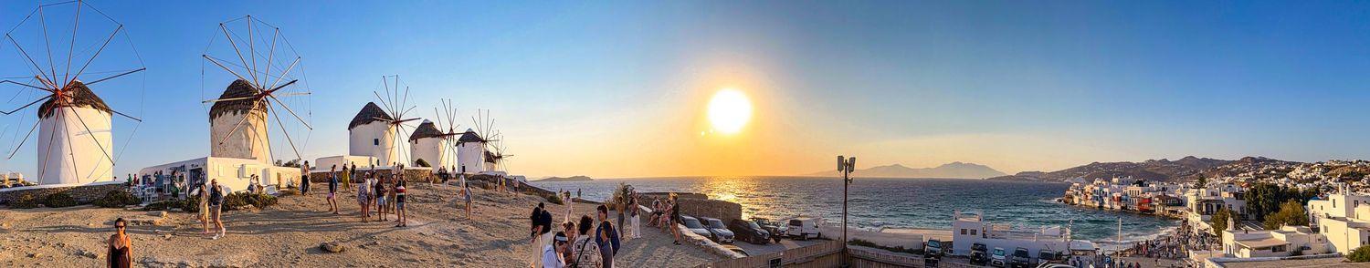 Historic windmills overlooking Mykonos Town at sunset in Mykonos, Greece