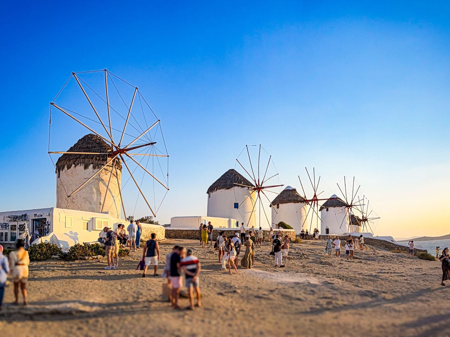 Historic windmills overlooking Mykonos Town and the Aegean Sea in Mykonos, Greece