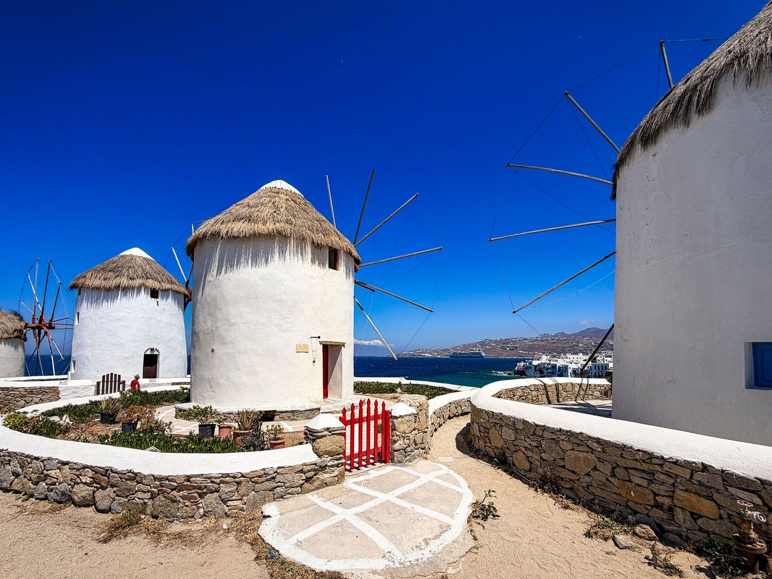 Historic windmills overlooking the Aegean Sea in Mykonos Town, Greece