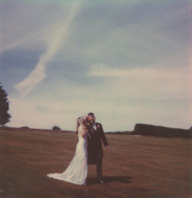 Polaroid of bride and groom at their English countryside wedding