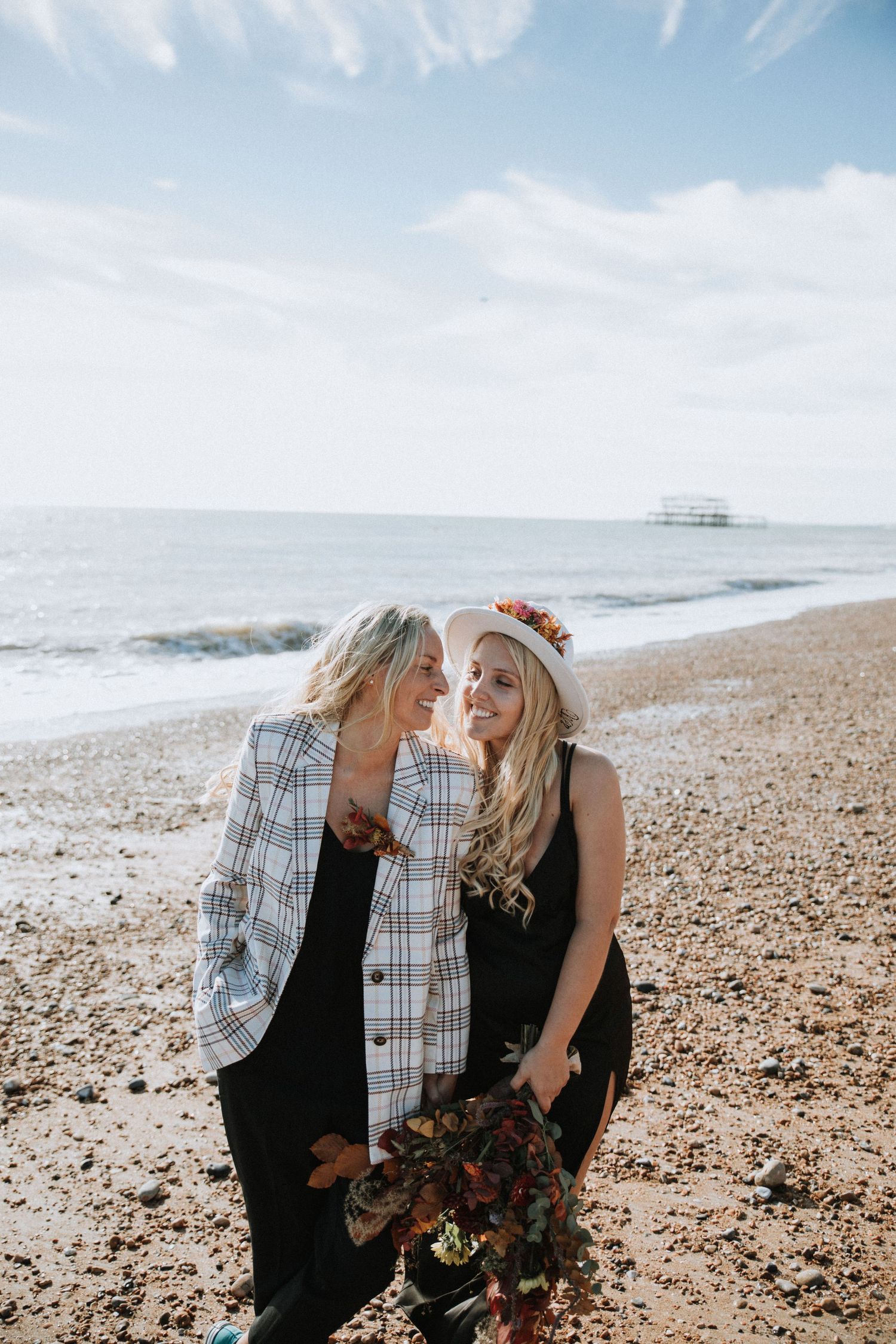 Two brides at their wedding on Brighton beach