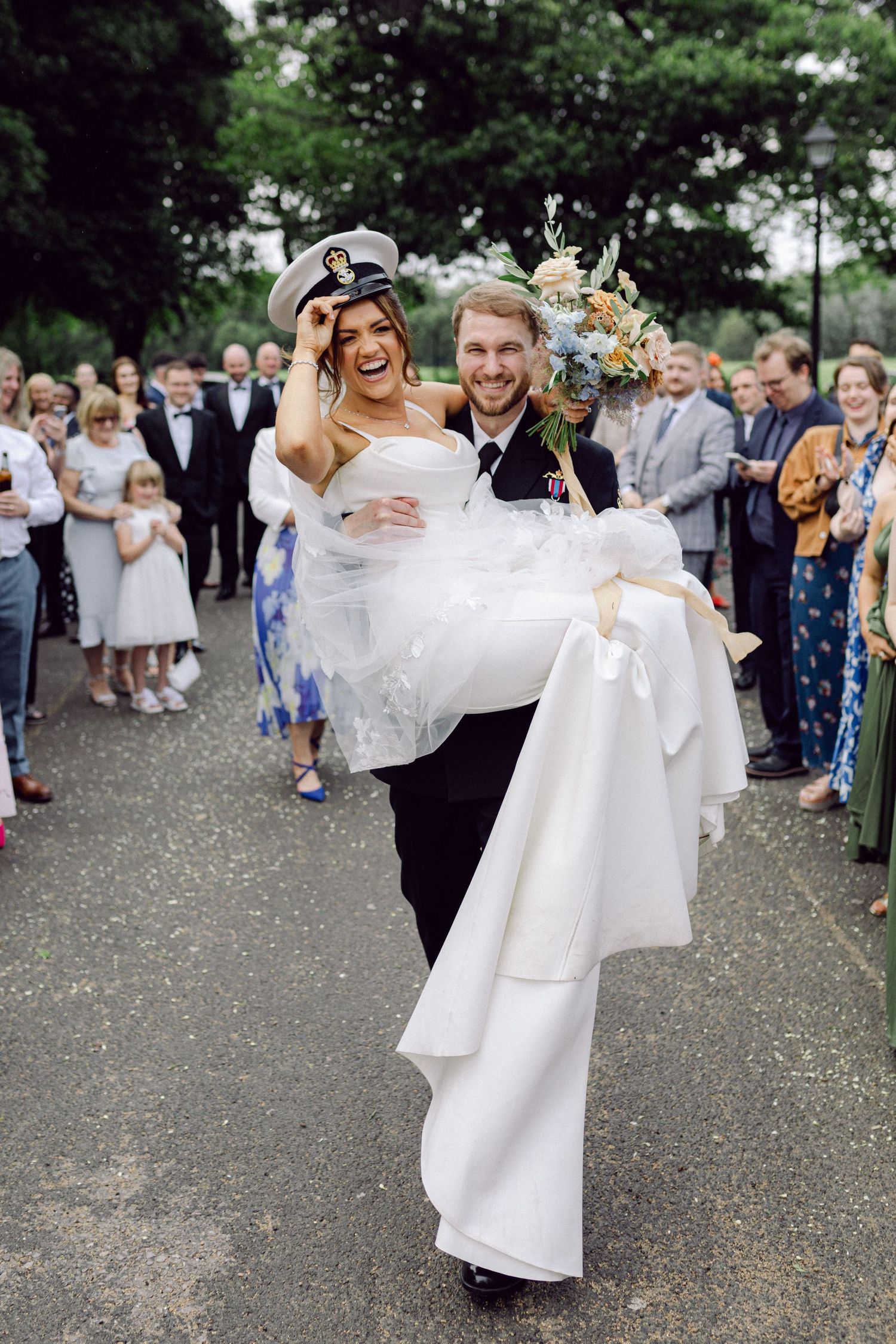 Bride being carried by groom at Liverpool Sefton Palm House
