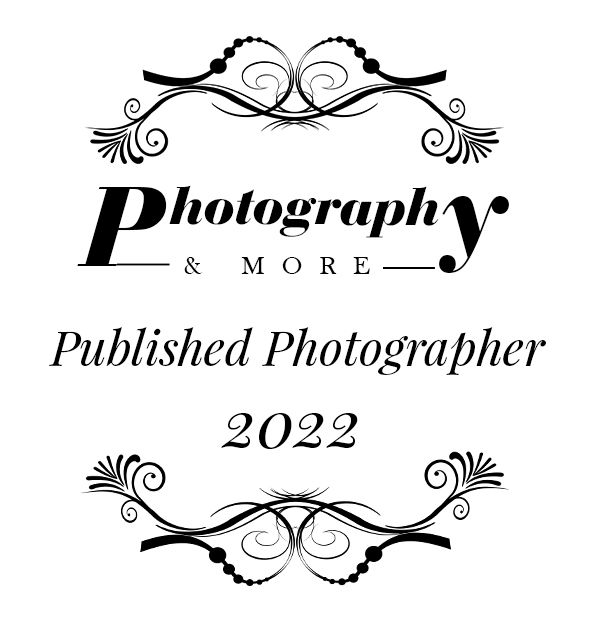 Photography & More Published Photographer 2022 logo with decorative scrollwork design.