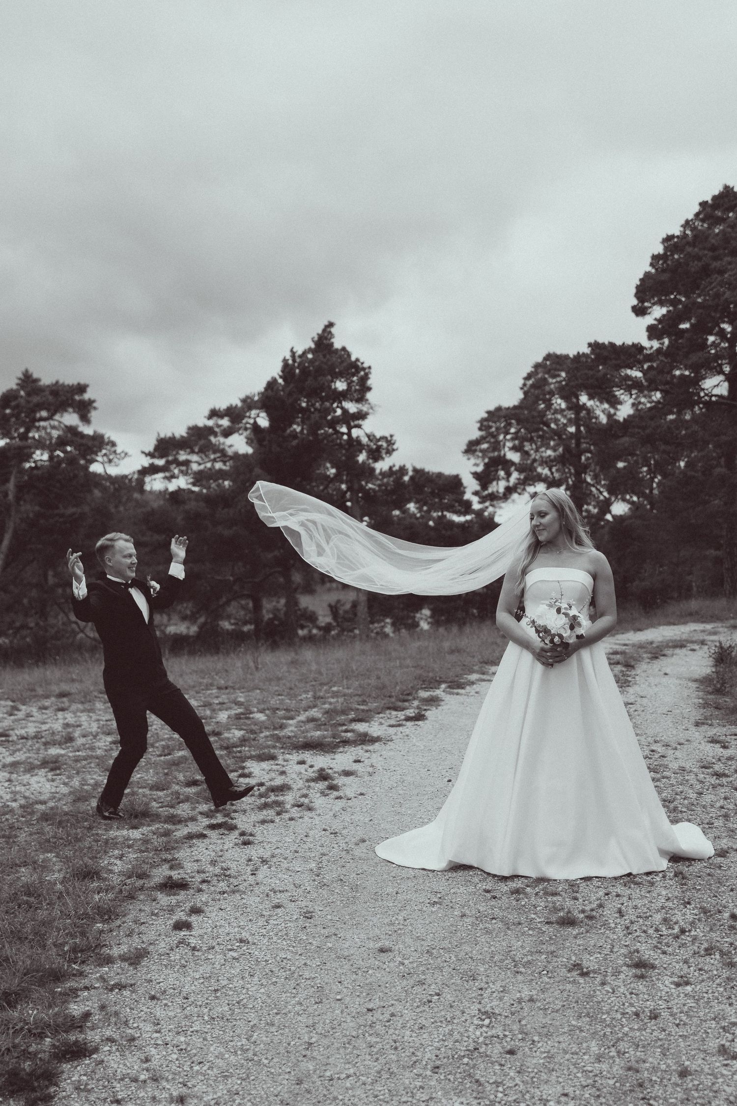 Black and white wedding photo sequence showing a flowing veil caught in the wind across a rocky landscape.