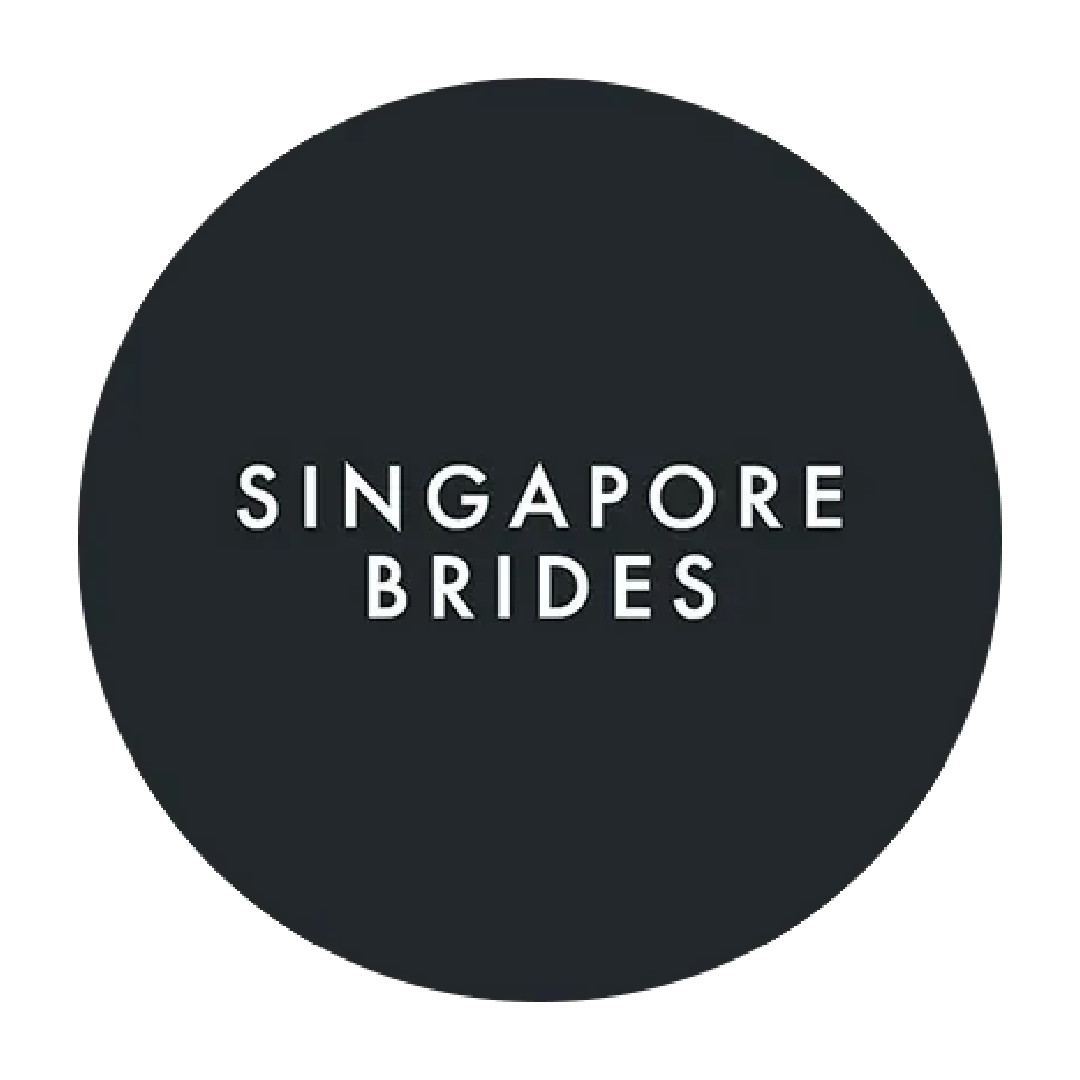 Singapore Brides logo featuring white text on a dark charcoal circular background.