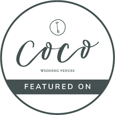 Minimalist grey and white circular logo for Coco Wedding Venues.