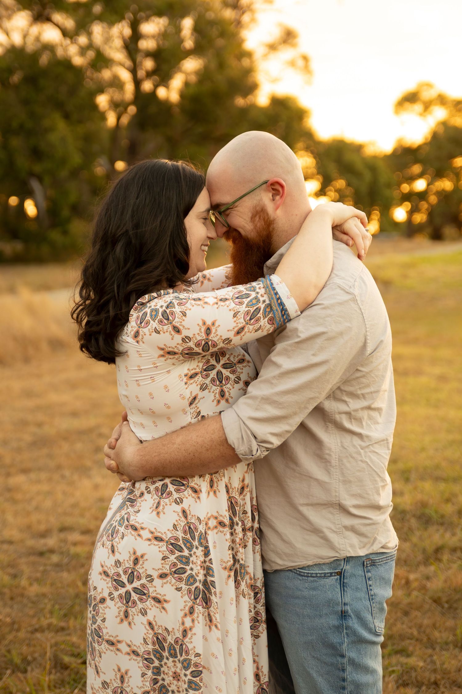 Melbourne family photographer - Husband and wife sharing a sweet quiet moment during sunset in south east suburbs of mel