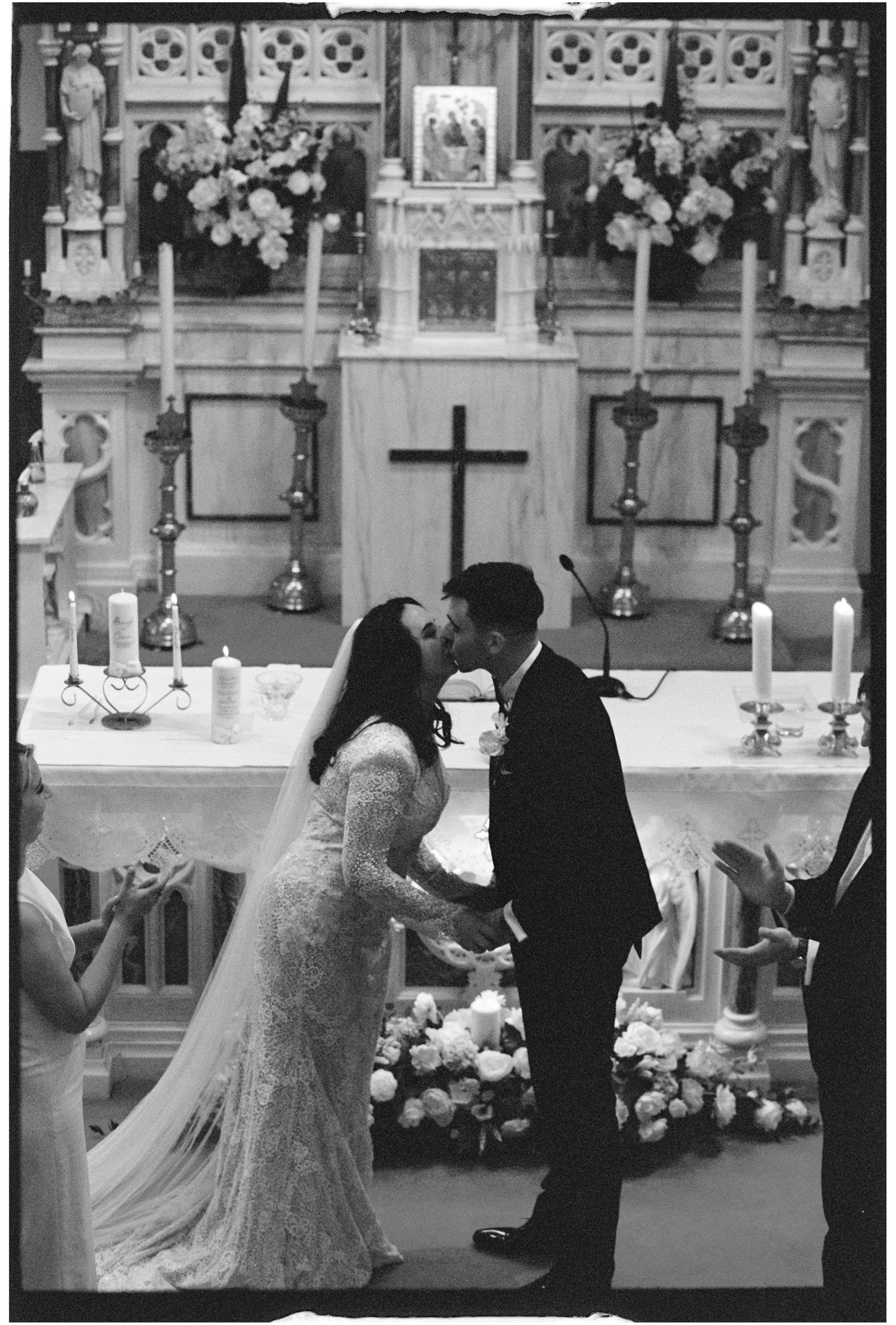 A traditional church wedding ceremony with ornate decorations and floral arrangements.
