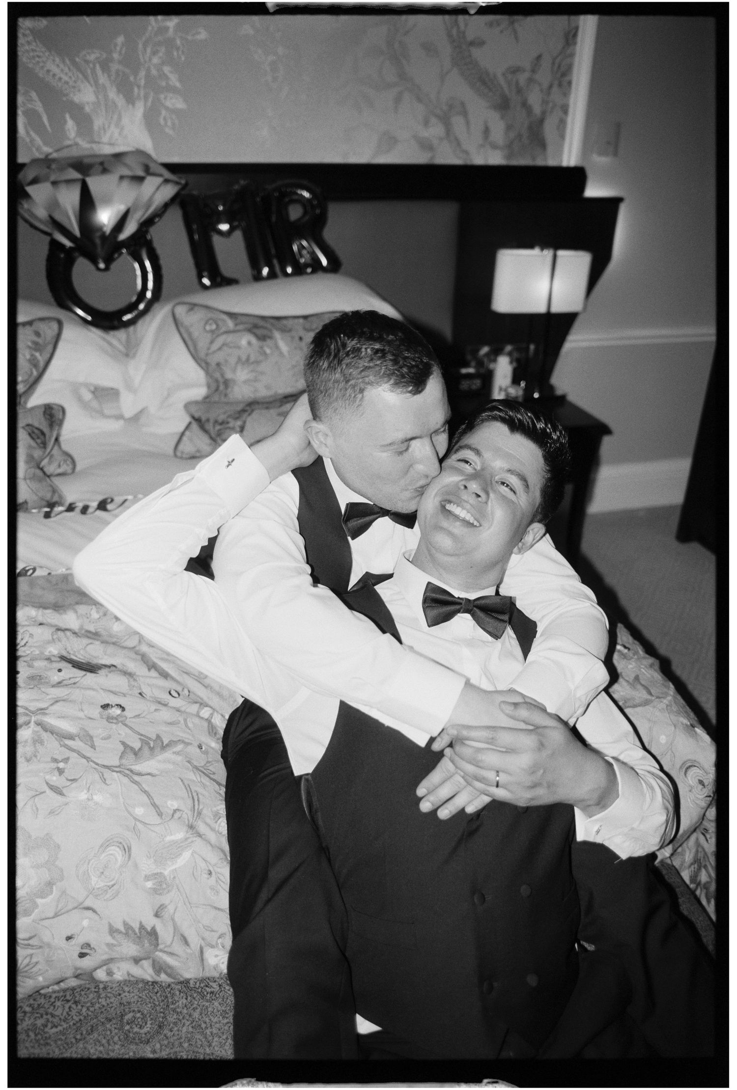 Two people in formal attire share intimate moments in black and white photographs.
