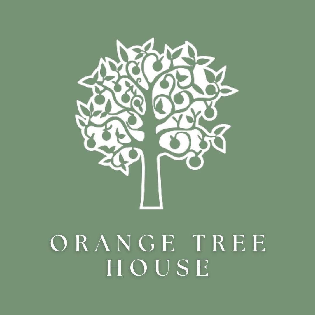 Green and white logo design for Orange Tree House with elegant floral motifs.