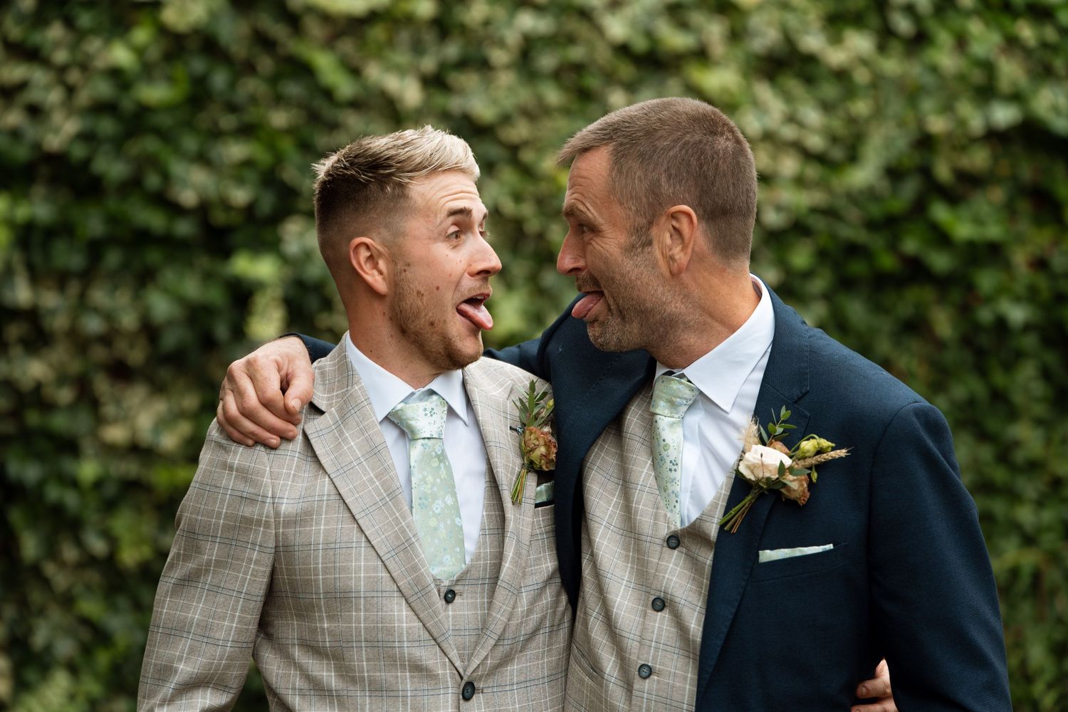 Candid wedding photos of couple in formal attire against an ivy wall backdrop.