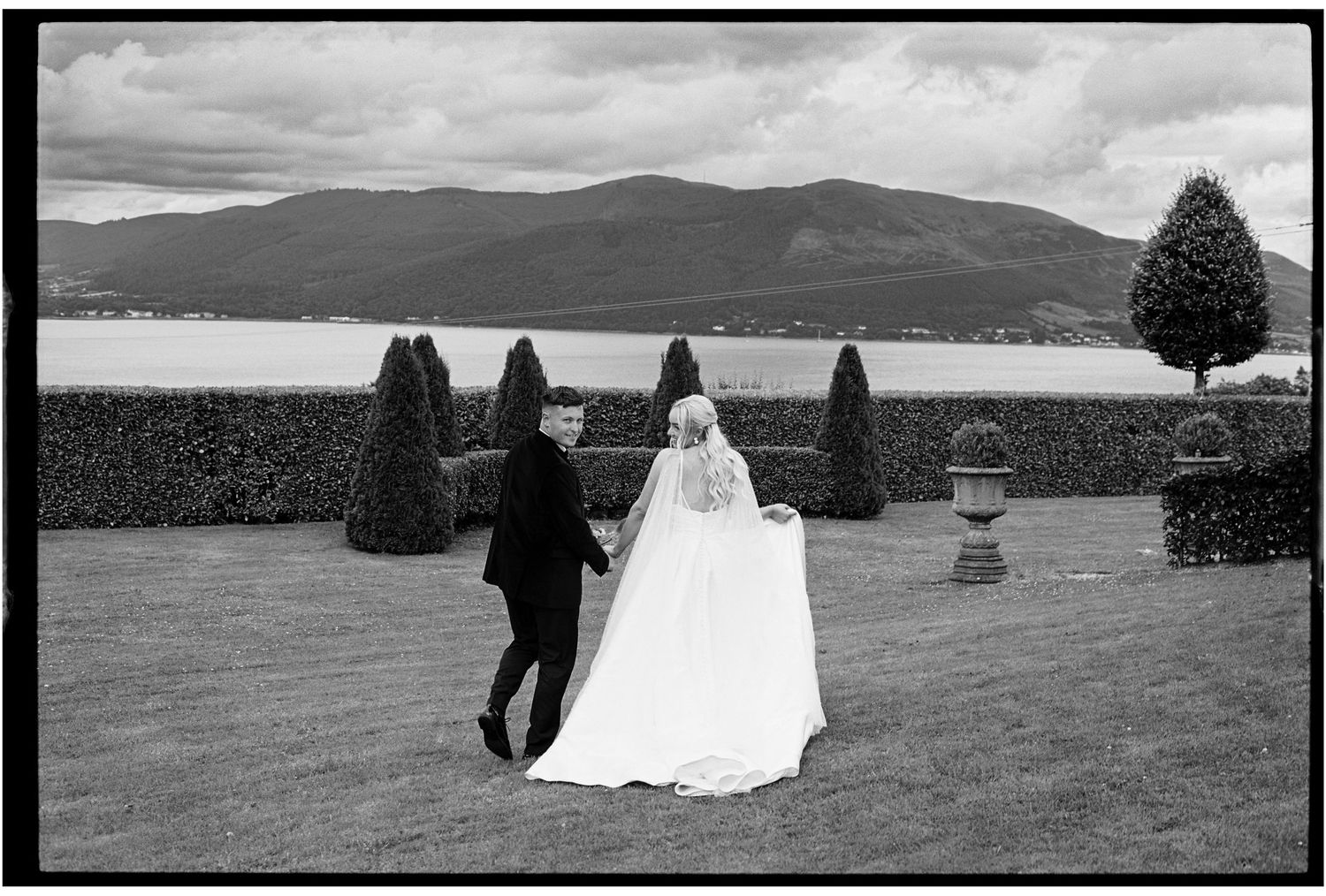 Black and white panoramic wedding photos in a scenic mountain landscape.