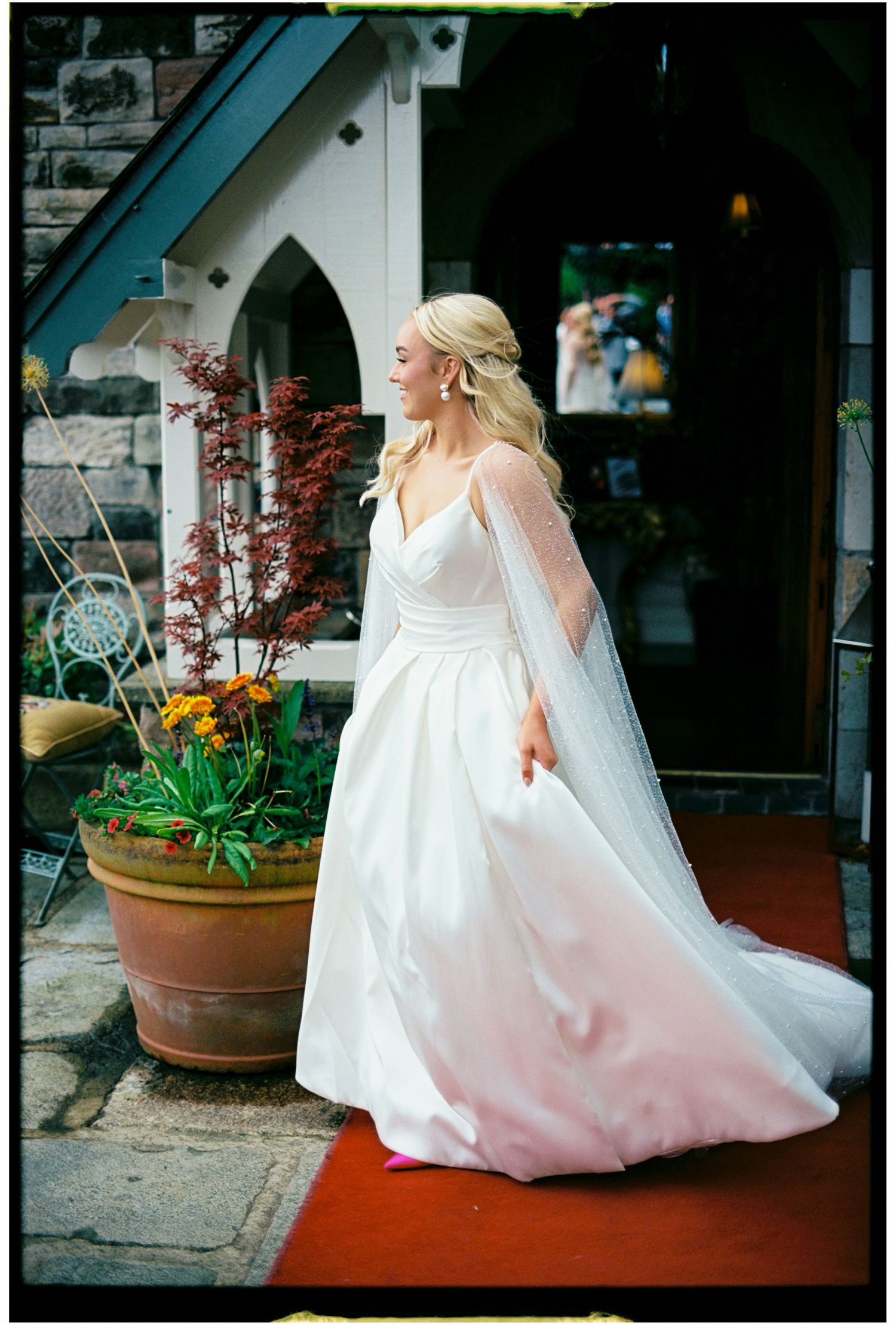 A sequence of wedding photos showing a bride in a flowing white gown walking gracefully across a paved area.
