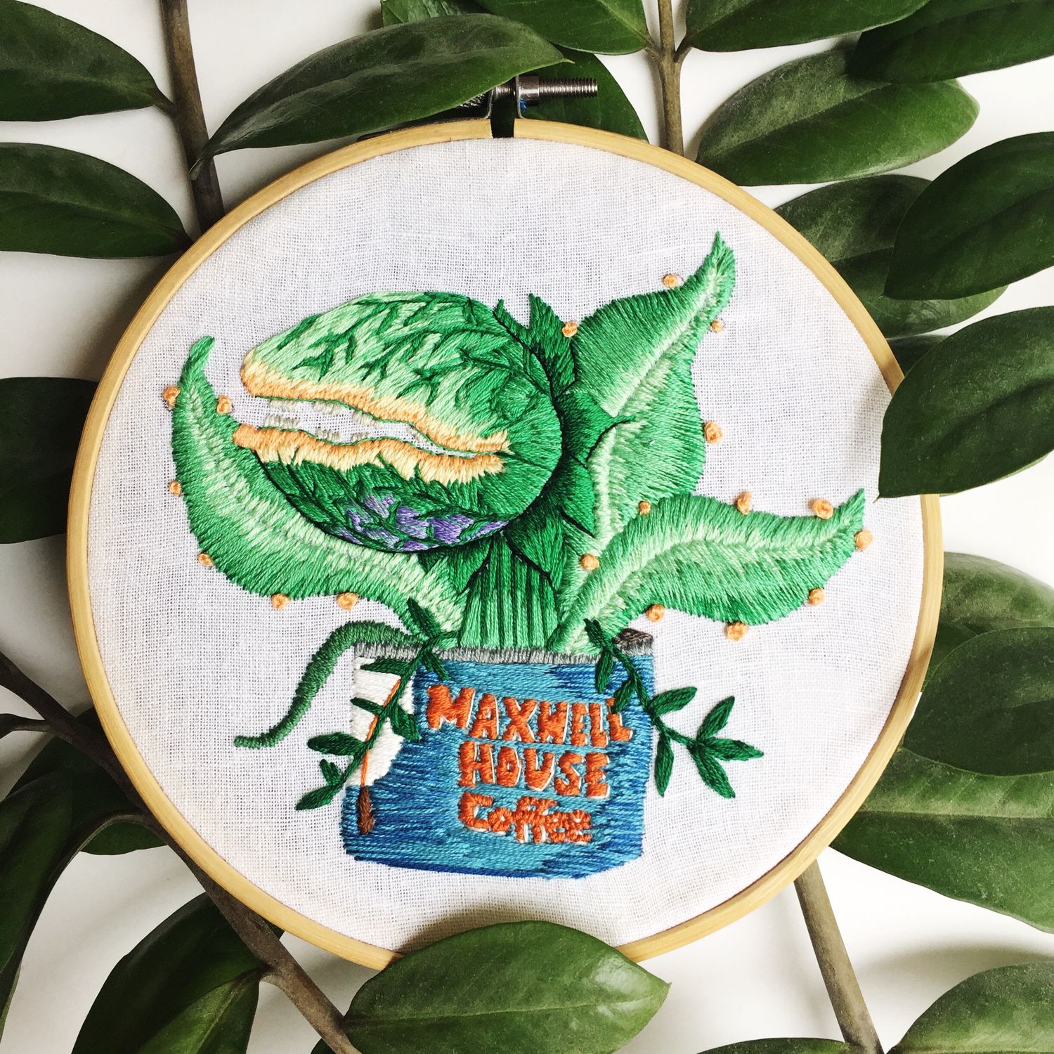 Embroidery hoop art featuring a Audrey 2 from Little Shop of Horrors.