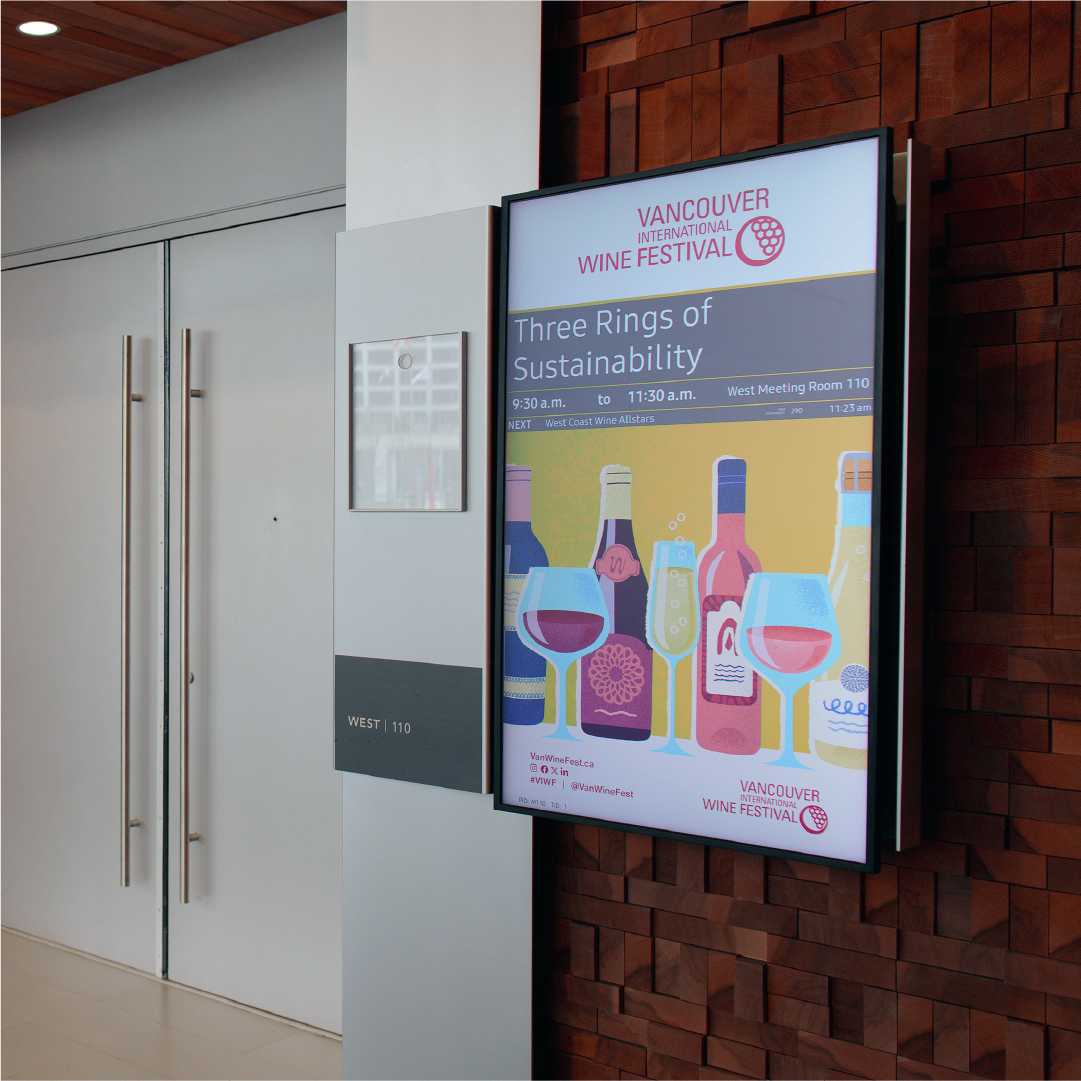 Digital display screen showing Three Rings of Sustainability seminar details at the Vancouver International Wine Festival.