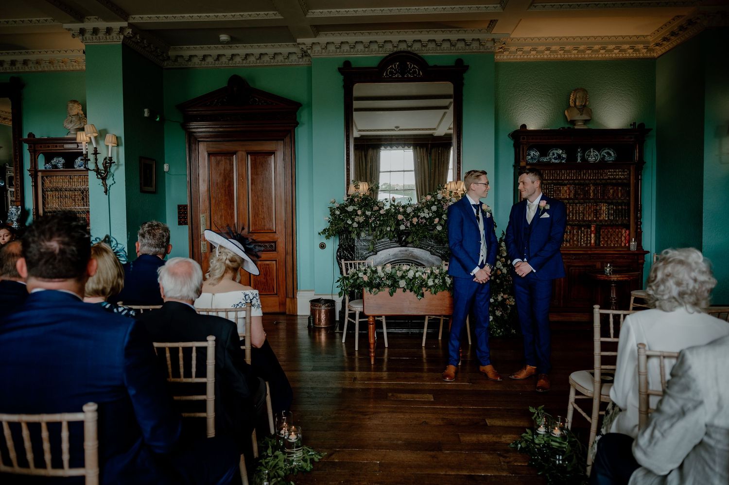 A cinematic wedding venue with large windows, elegant architecture, and natural light flowing through the ceremony space.