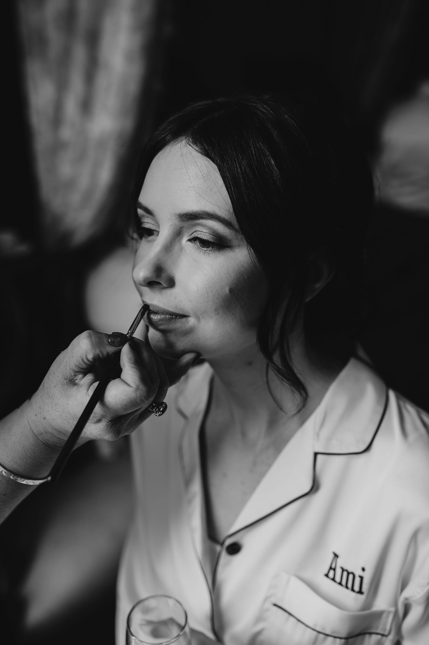 Dramatic black and white photo series showing someone in white smoking viewed from side angles in moody lighting.