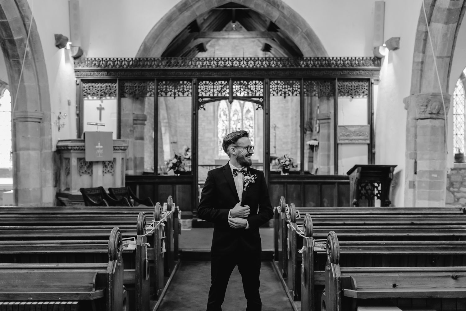 Black and white architectural interior photographs showing church pews and arched walkways with gothic details.