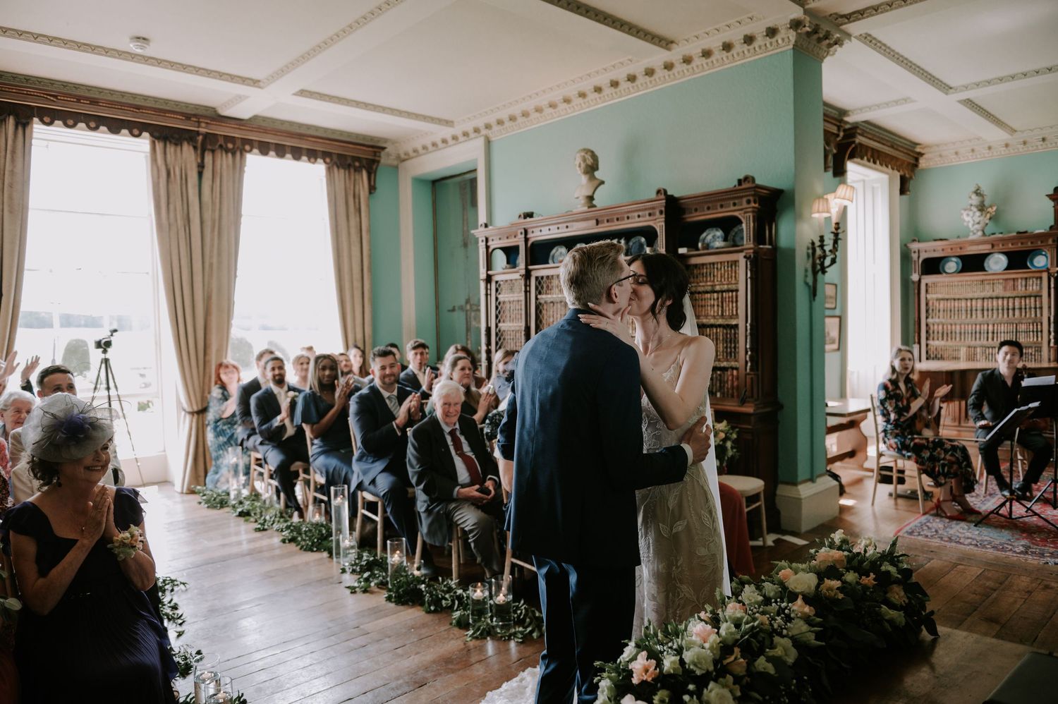 A panoramic sequence of a wedding ceremony showing decorations, seating arrangements and guests inside an ornate venue.