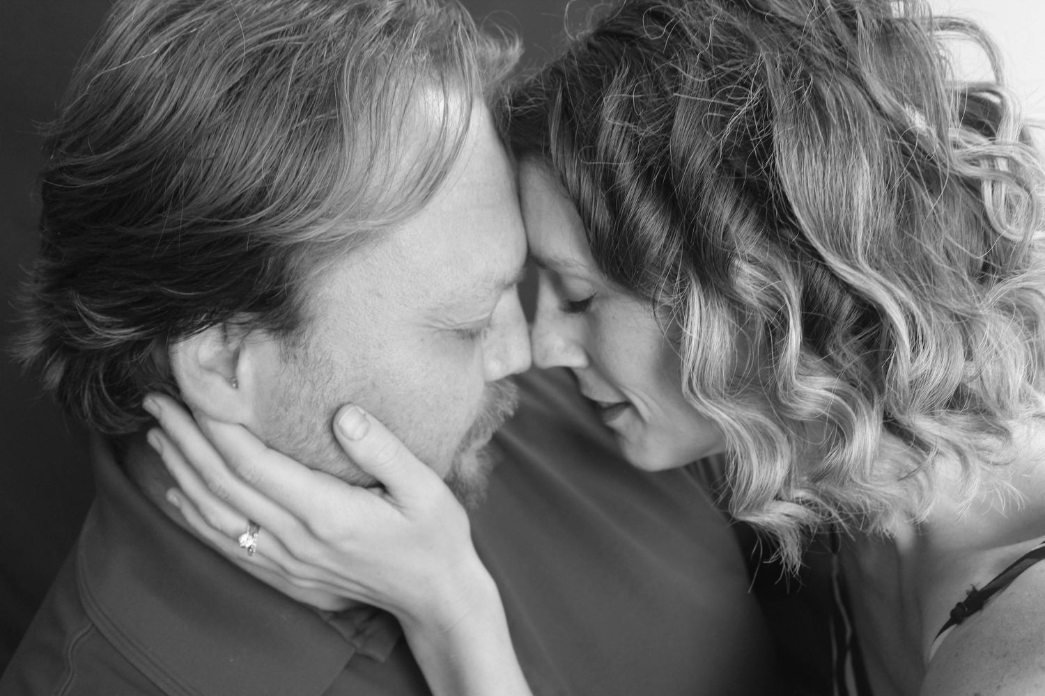 Husband and wife lovingly being themselves in an in-home studio photoshoot in Greenfield, IN