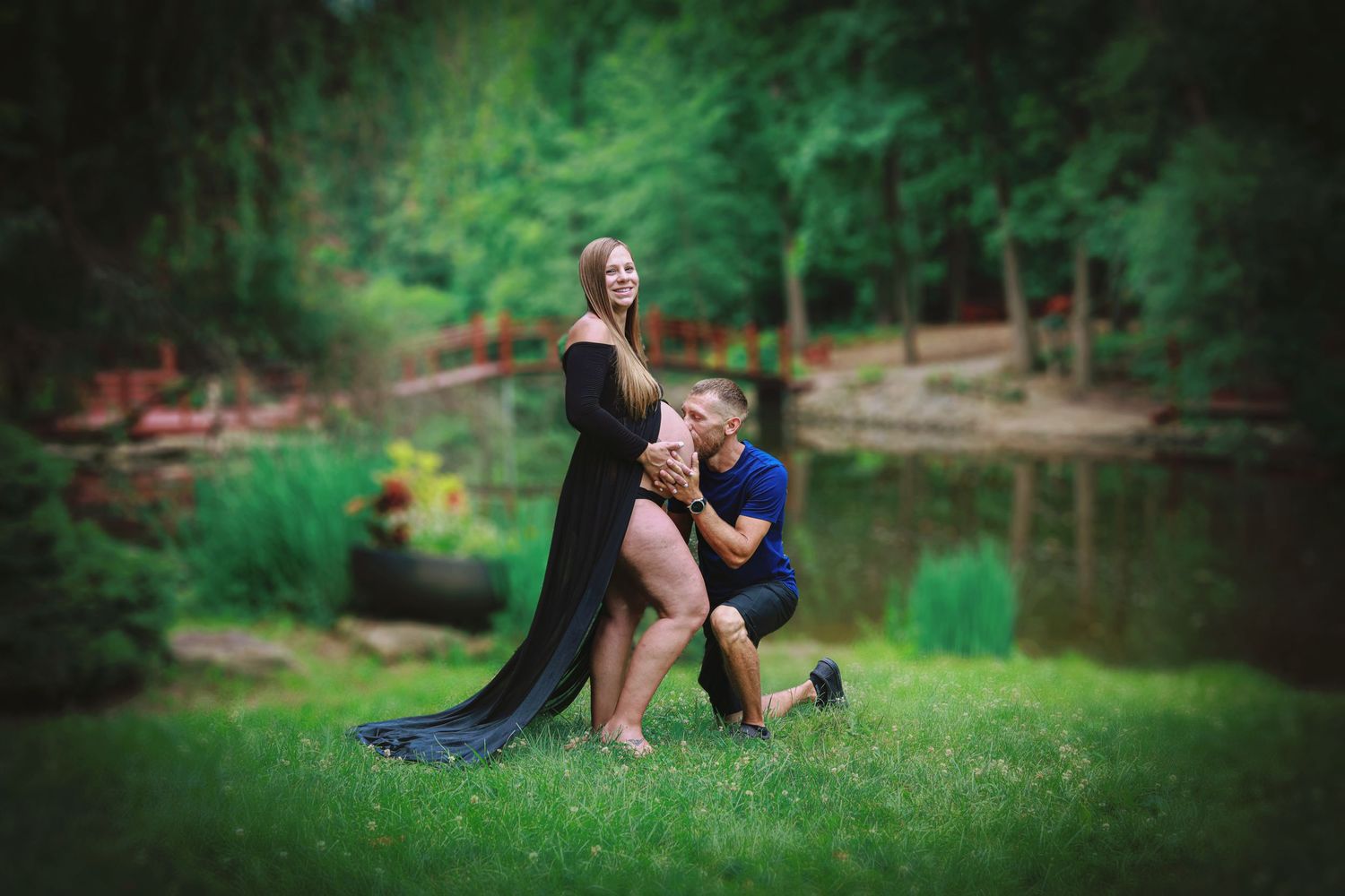Dad kissing pregnant belly during maternity session in Trafalgar, IN.