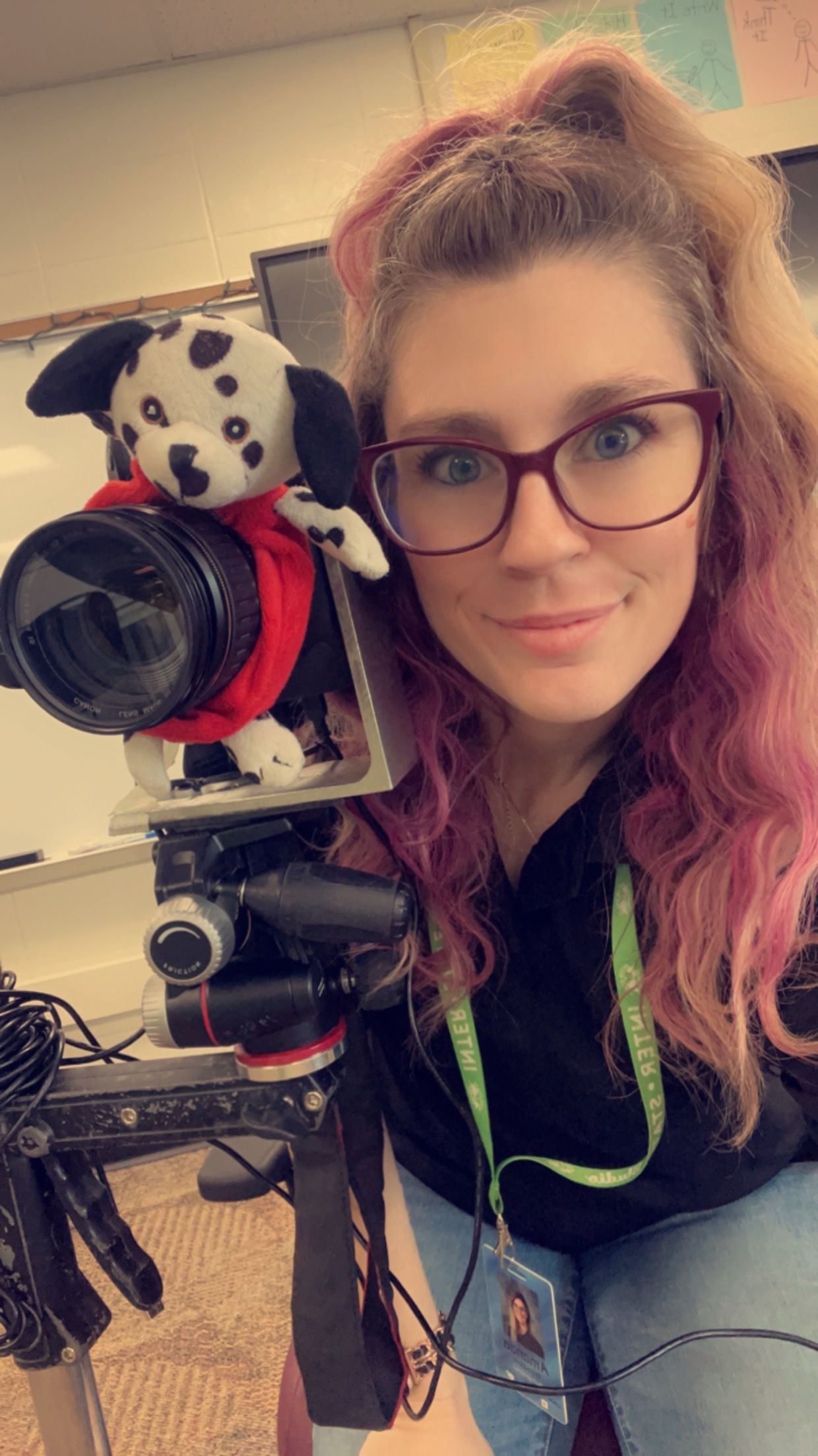 Indiana photographer with canon camera on a stand and camera buddy (puppy) smiling eager to take photos.