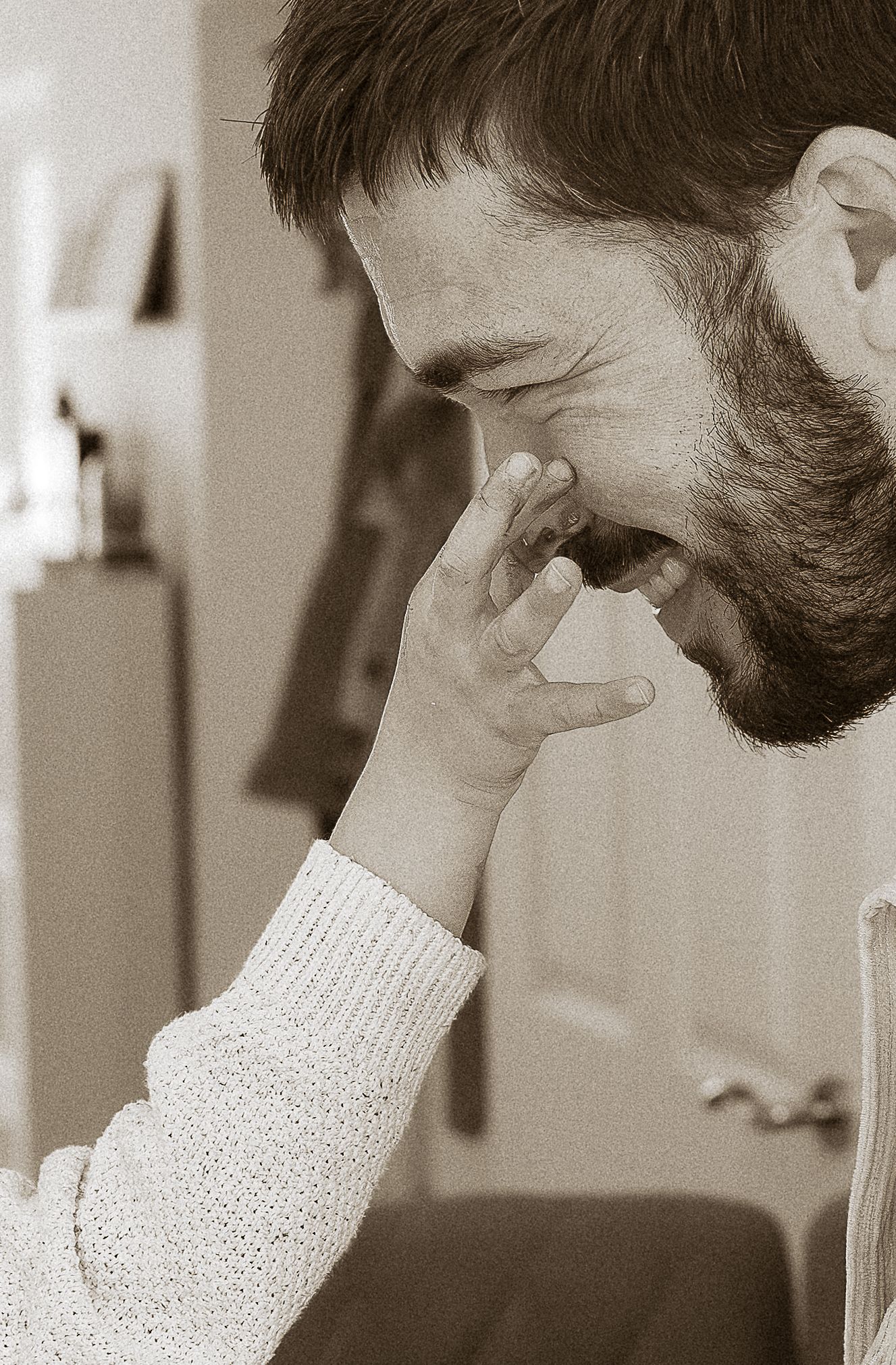 Storytelling Photoshoot of son getting cake chocolate on dads nose in Tetbury, Cotswolds.