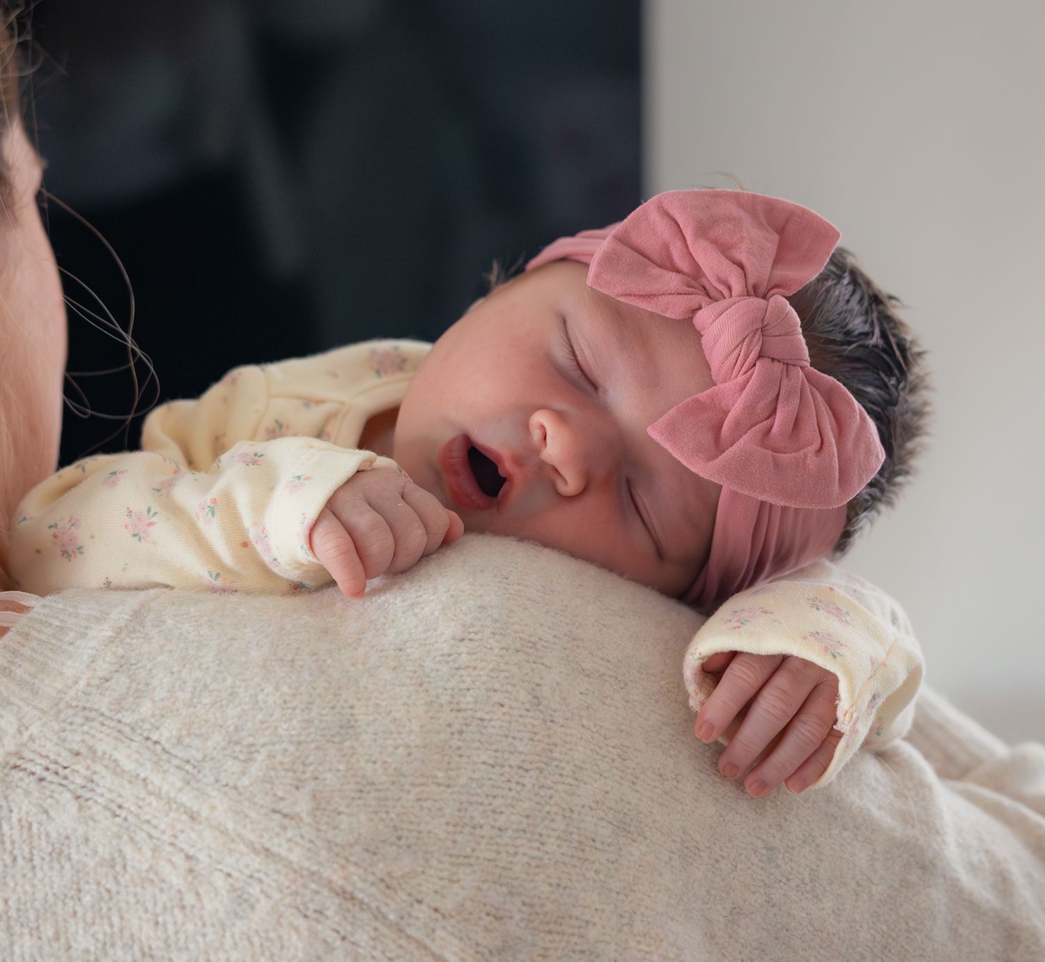 A sleepy newborn babygirl resting on mums shoulder. Laverton, Cotswolds.
