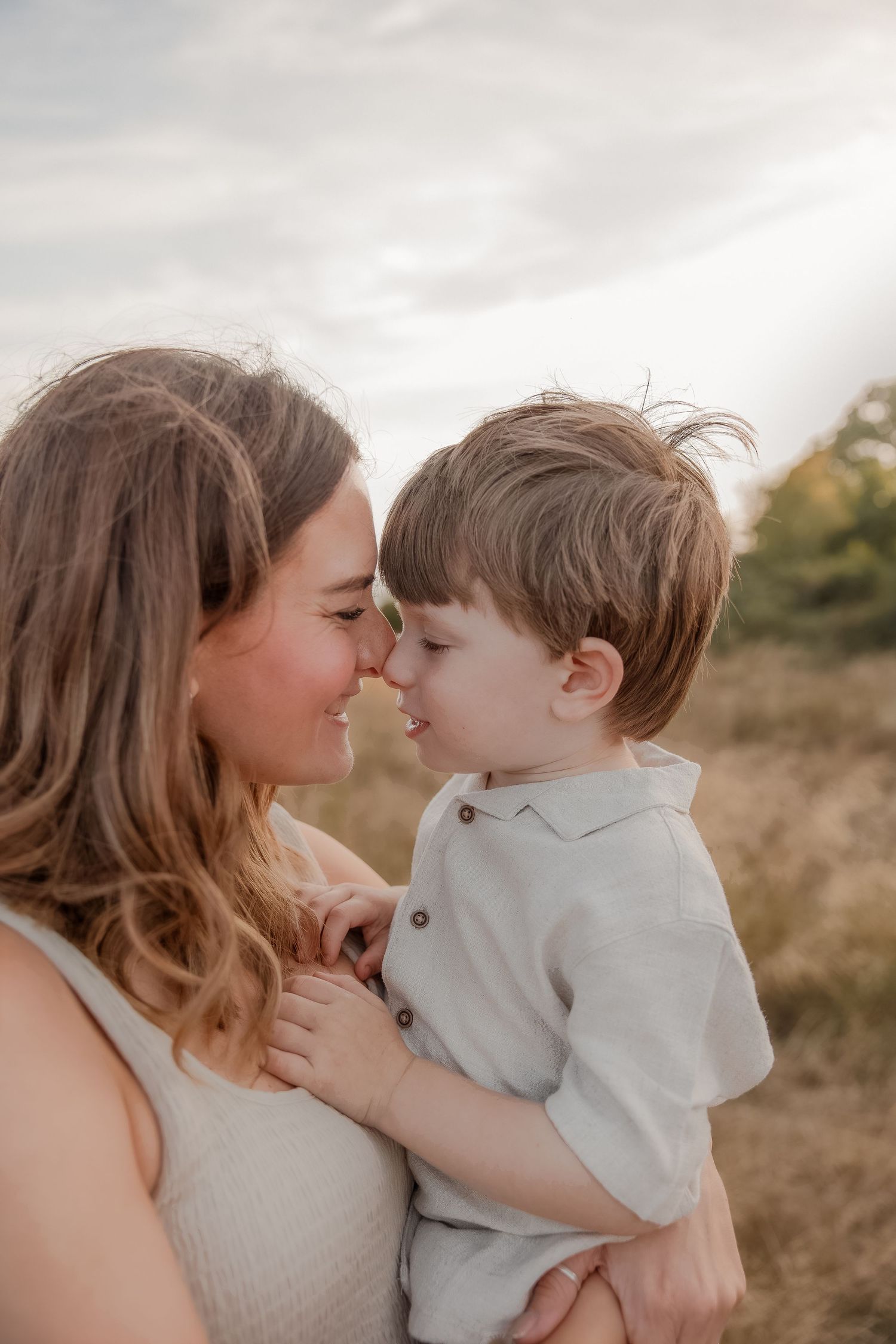 A mother and young boy share a tender nose-to-nose during a Family Photoshoot in Bath, Somerset.