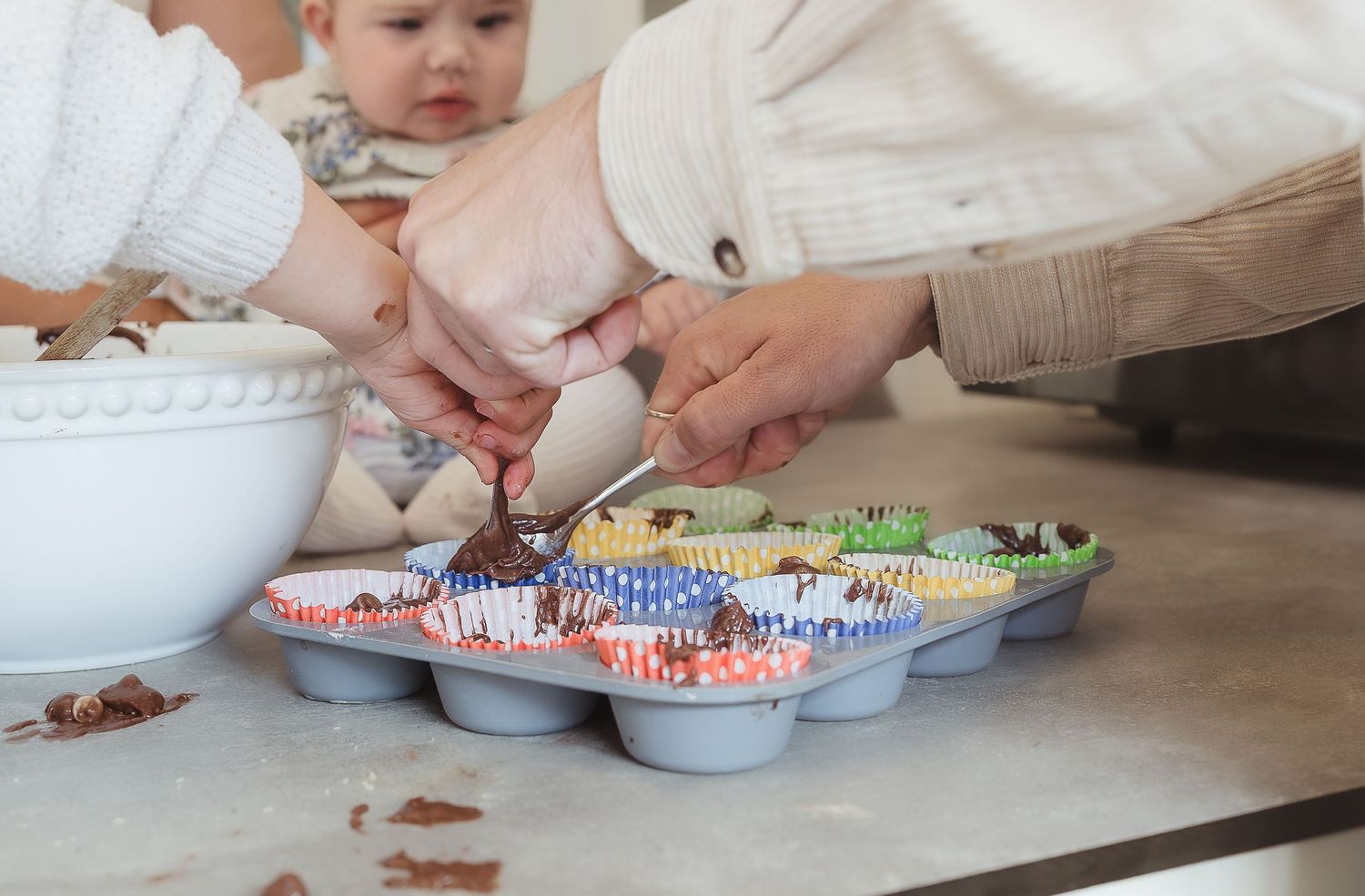 Storytelling photoshoot of family of four baking cakes at their home in Broadway, Cotswolds.