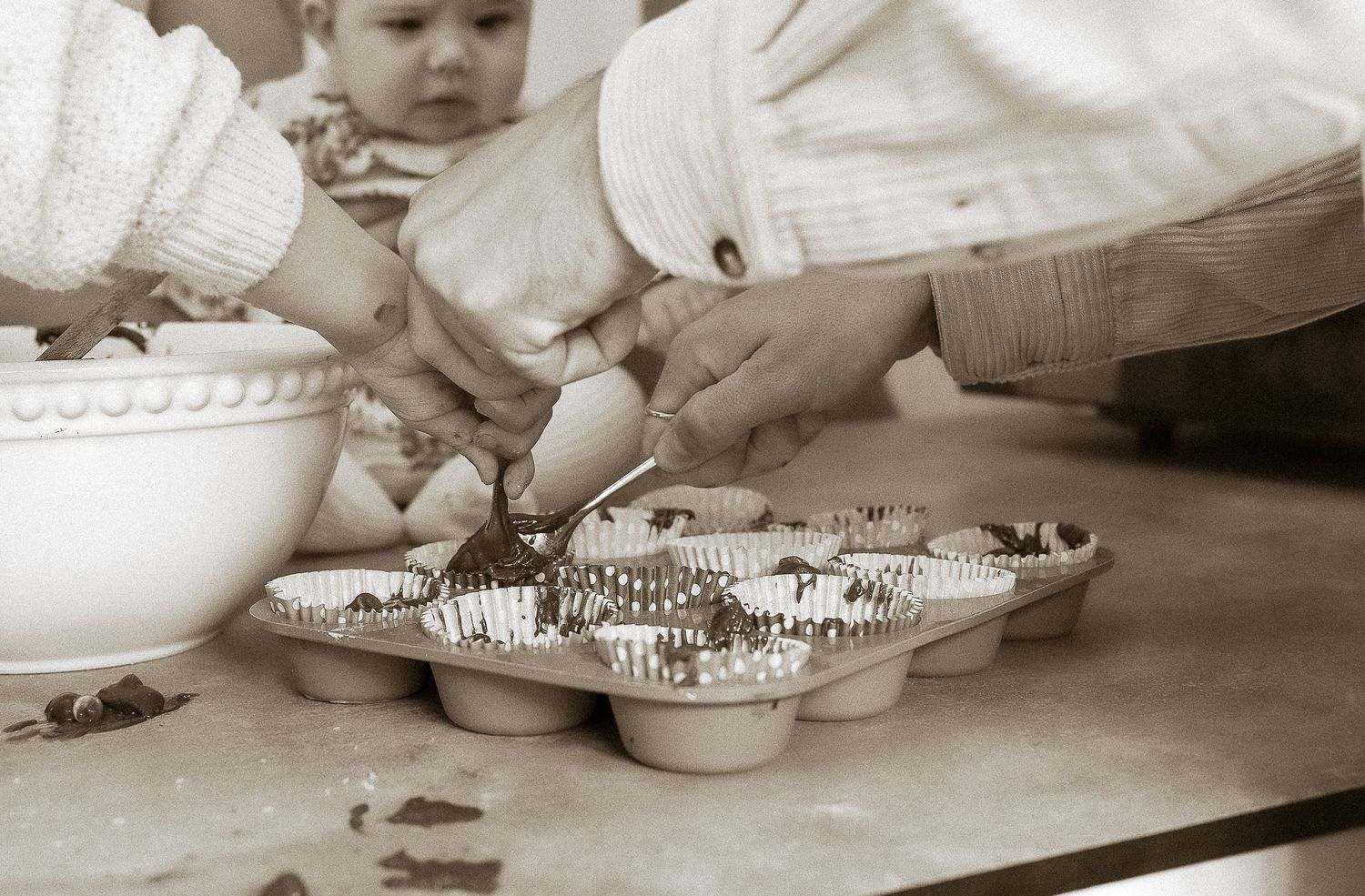 Storytelling Photoshoot of family mixing baking cakes in Tetbury, Cotswolds.