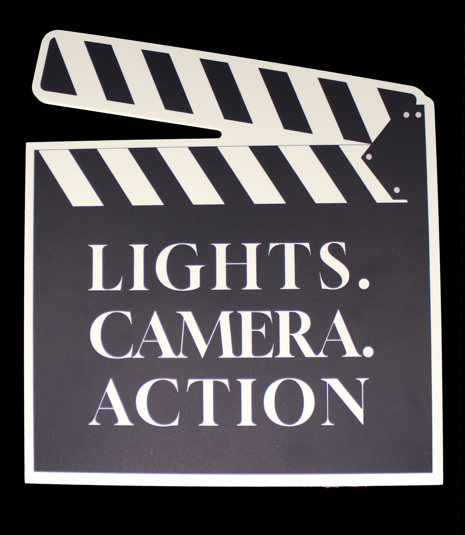 A large film clapperboard cutout with Lights Camera Action text for movie-themed decor.