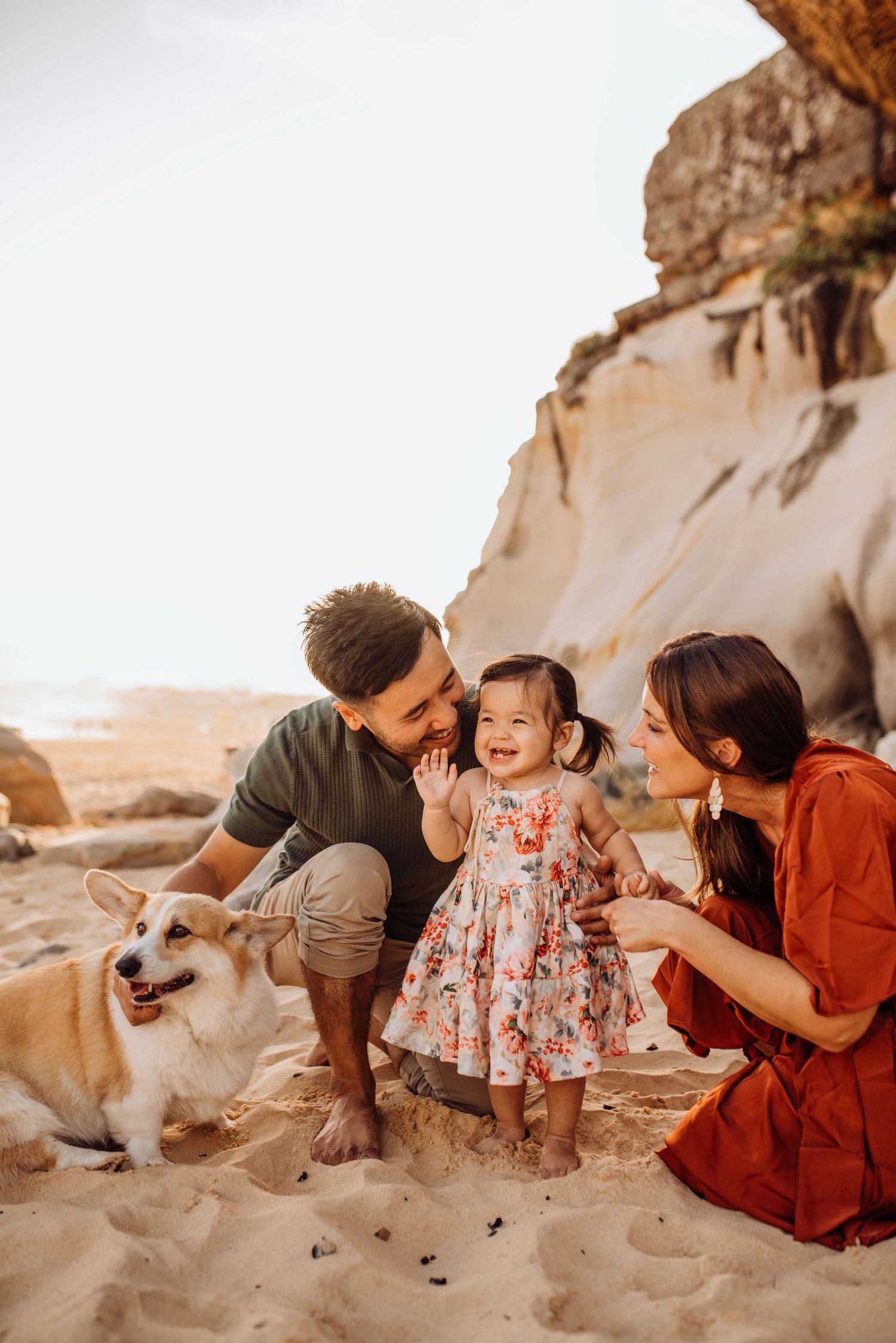 Northern Beaches family photography of family with dog at the beach in relaxed moment