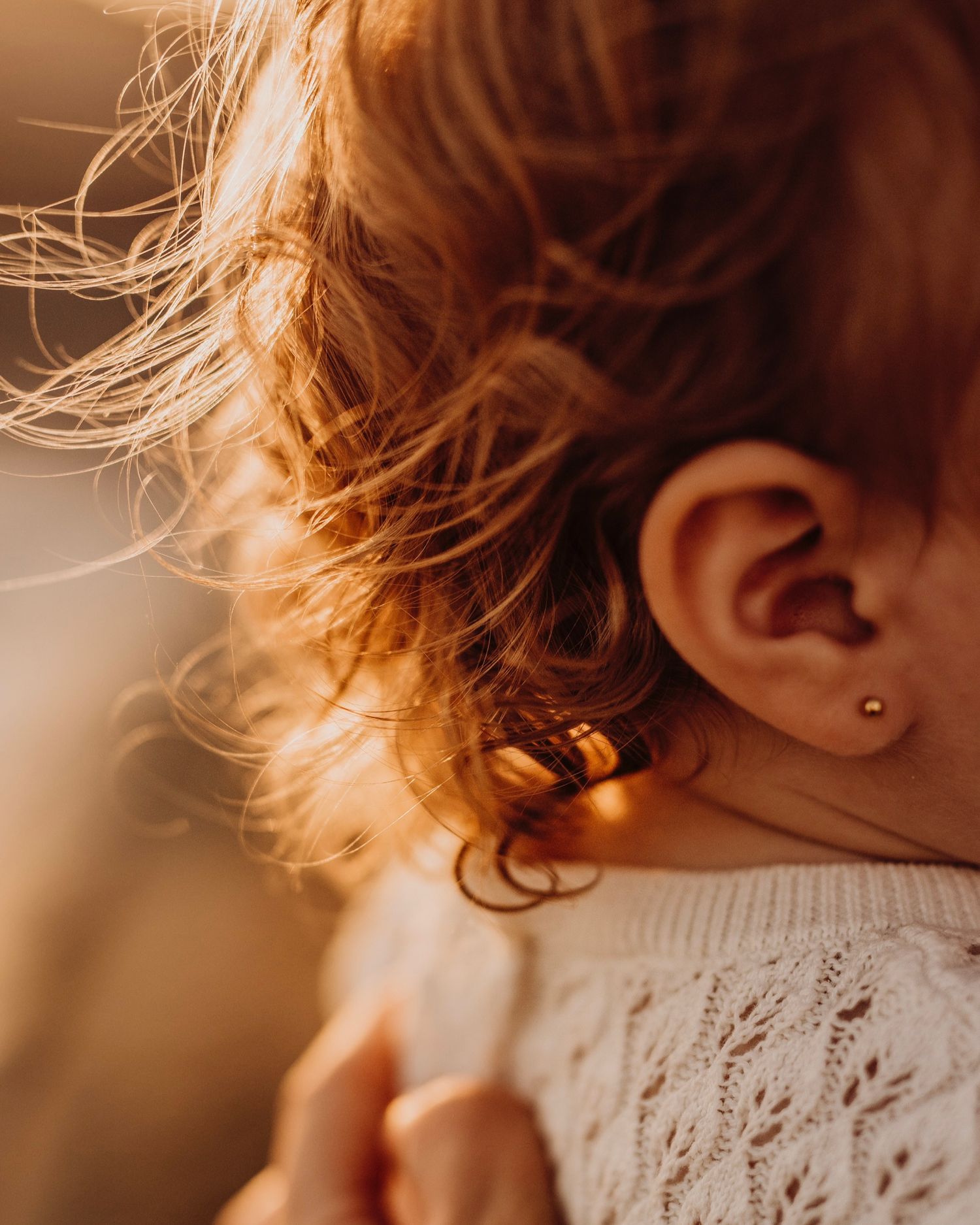 Northern Beaches family photography close-up of child’s hair and details in golden sunset light