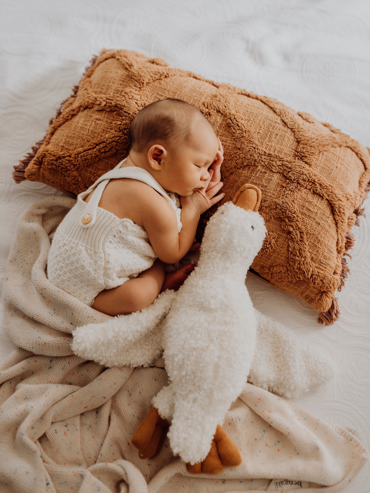 Baulkham Hills newborn photography of baby wrapped on neutral textured bedding