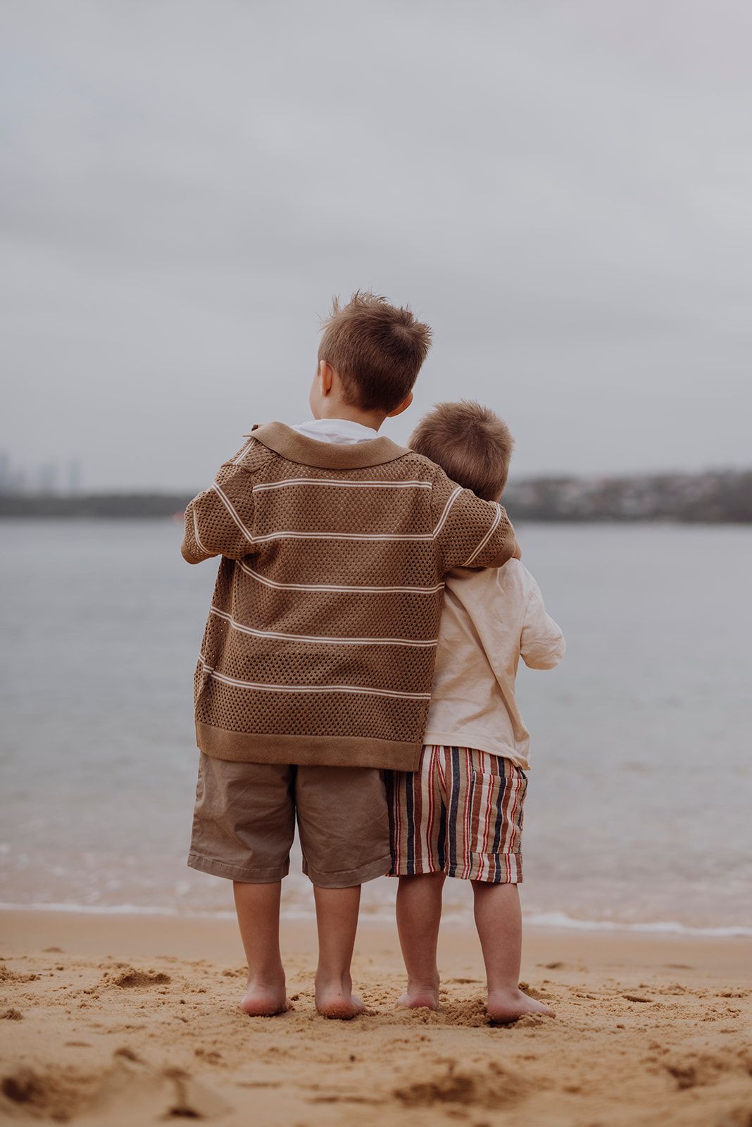 Watsons Bay family photography of two young boys standing together looking out to sea