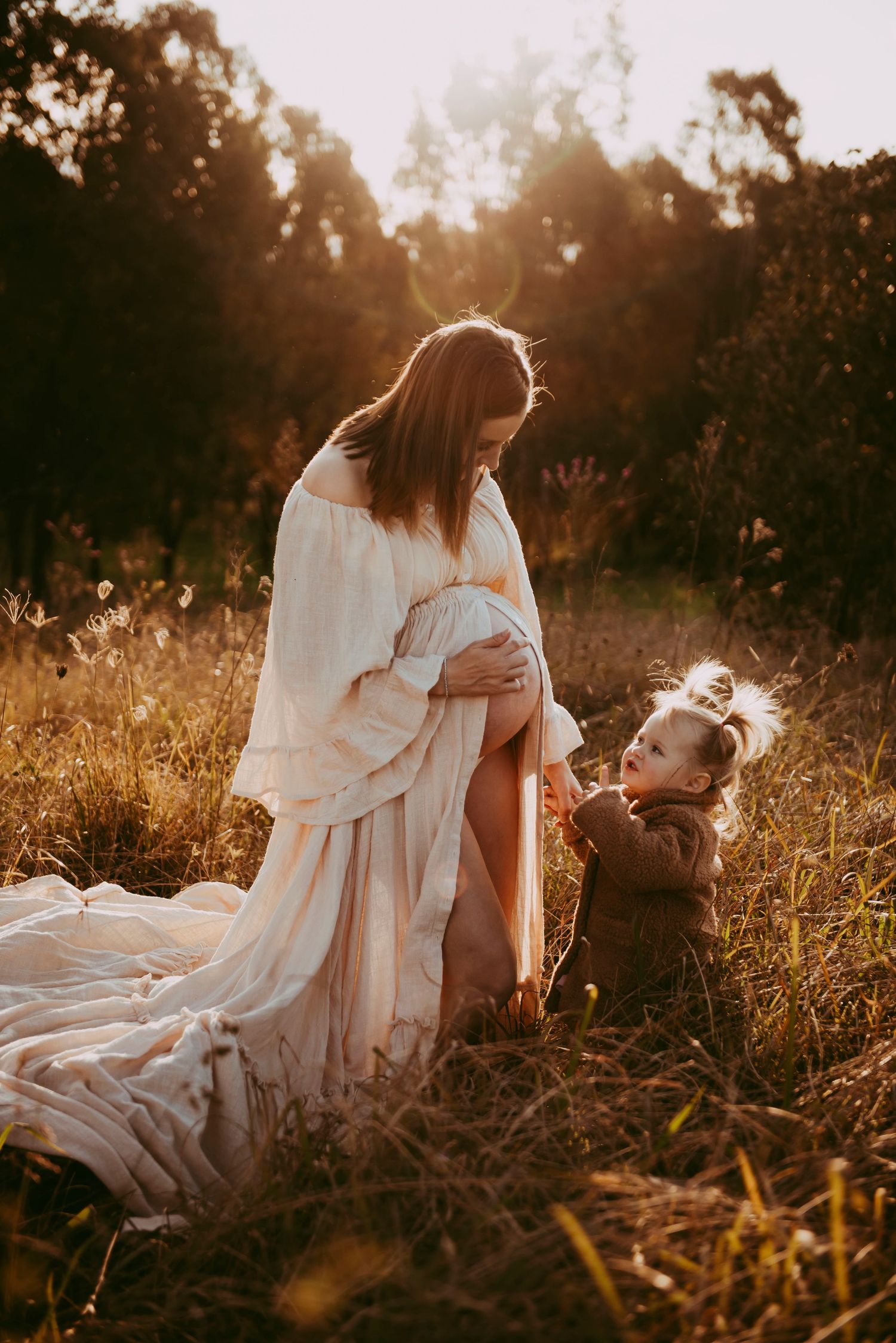 Camden maternity session with mother and child in golden light field at sunset