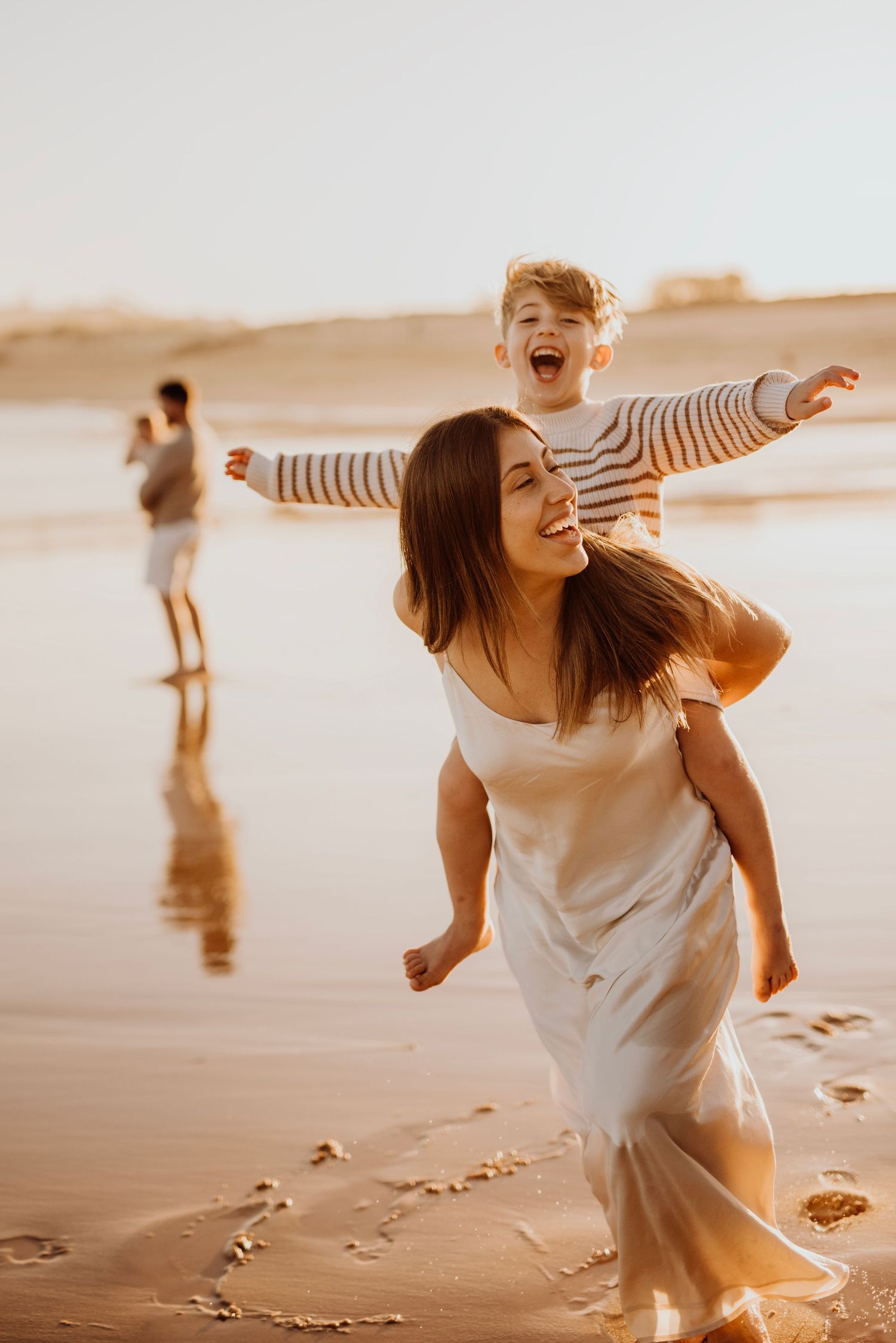 mother and child playing on the beach at sunset family photography Northern Beaches Sydney natural lifestyle session