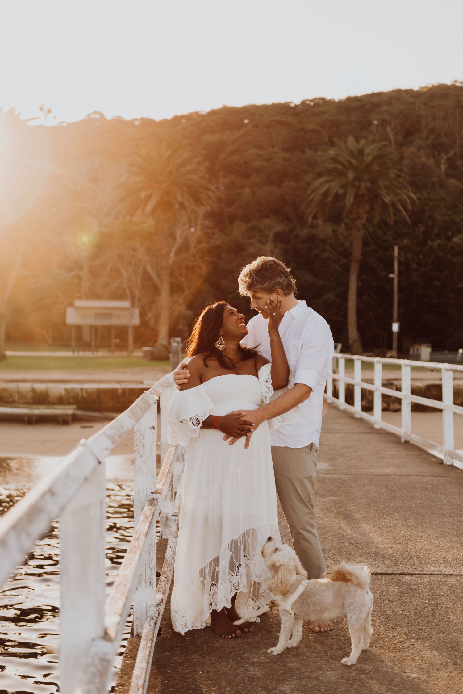 Family maternity photography session on Sydney beach with couple and dog at sunset- mosman. ivf success story Rainbow baby