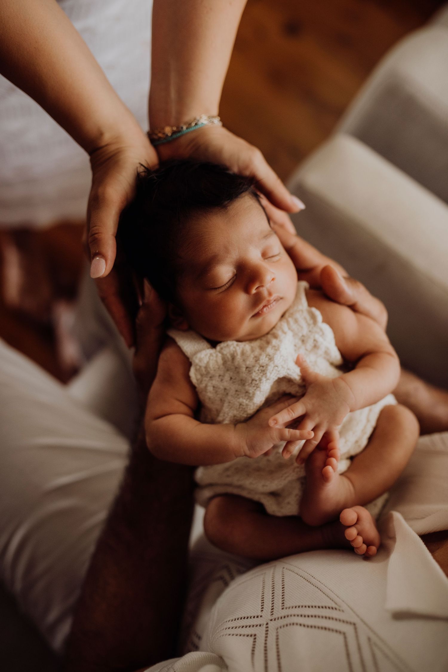 Northern Beaches newborn photography of mother cuddling baby in soft natural light. Rainbow baby