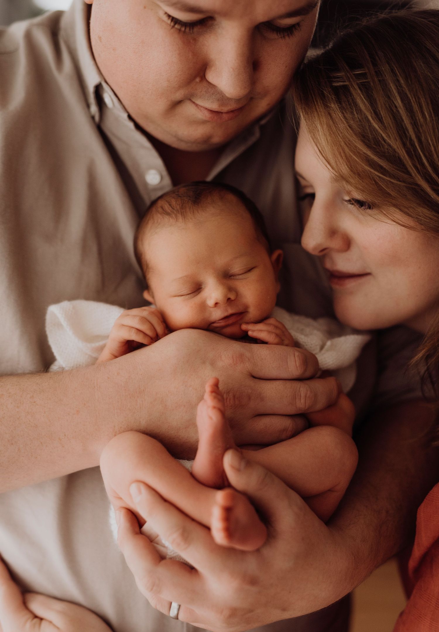 newborn photography of family with baby and dog in light-filled in-home photoshoot. Oran park