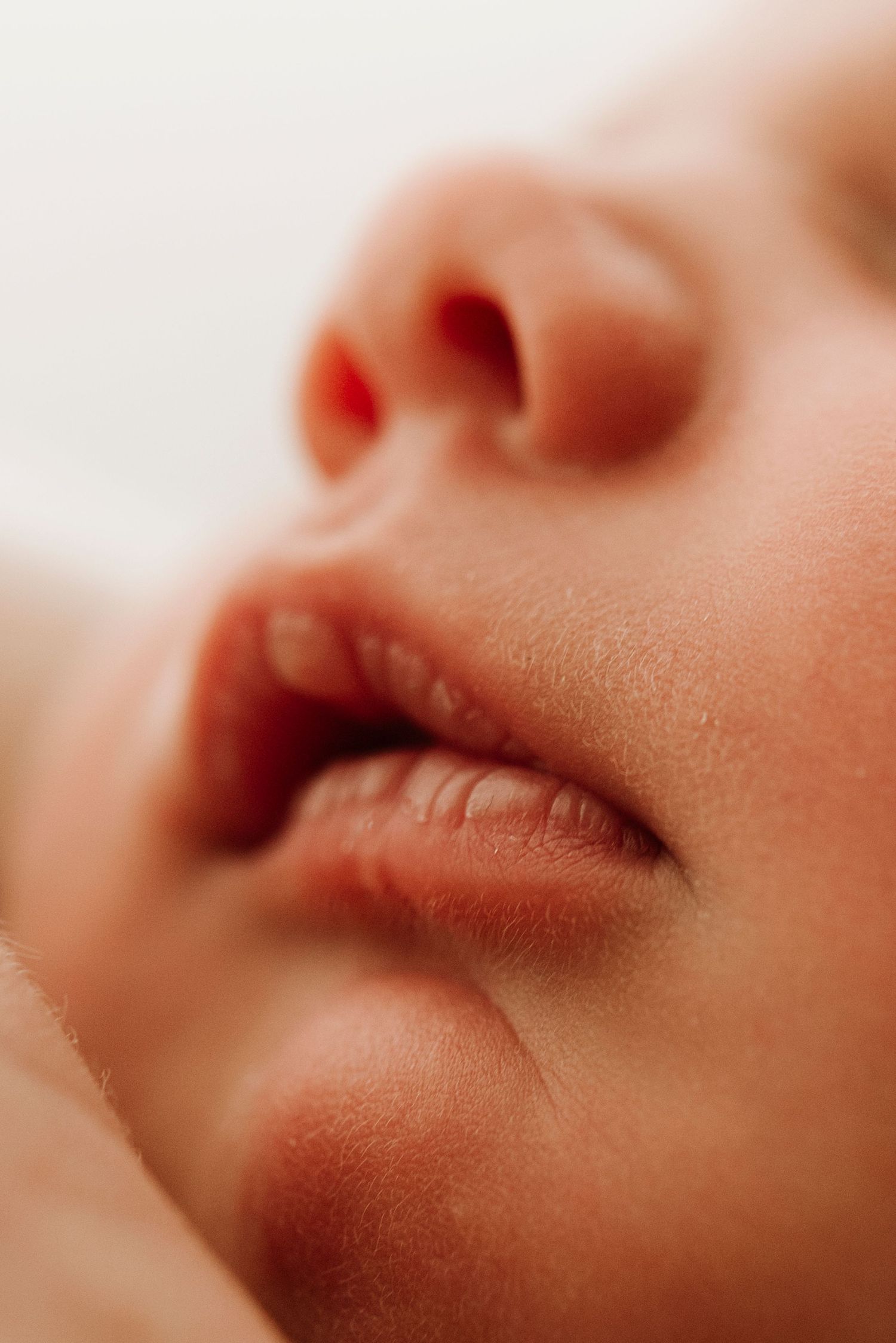 close up of newborn baby lips in-home newborn photography Mosman Sydney natural lifestyle session IVF rainbow baby