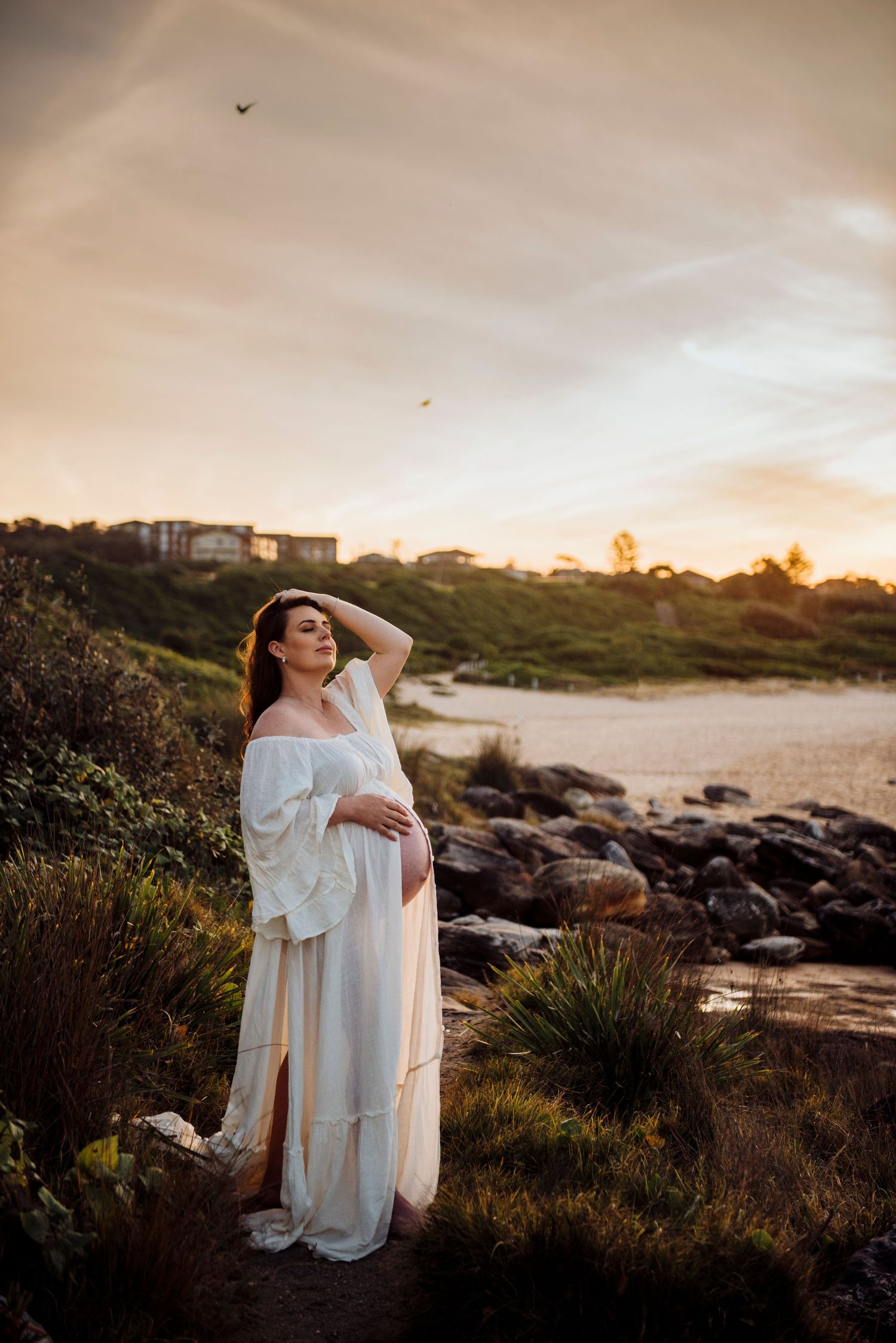 pregnant woman at sunset beach maternity photography Maroubra Sydney natural light IVF success story